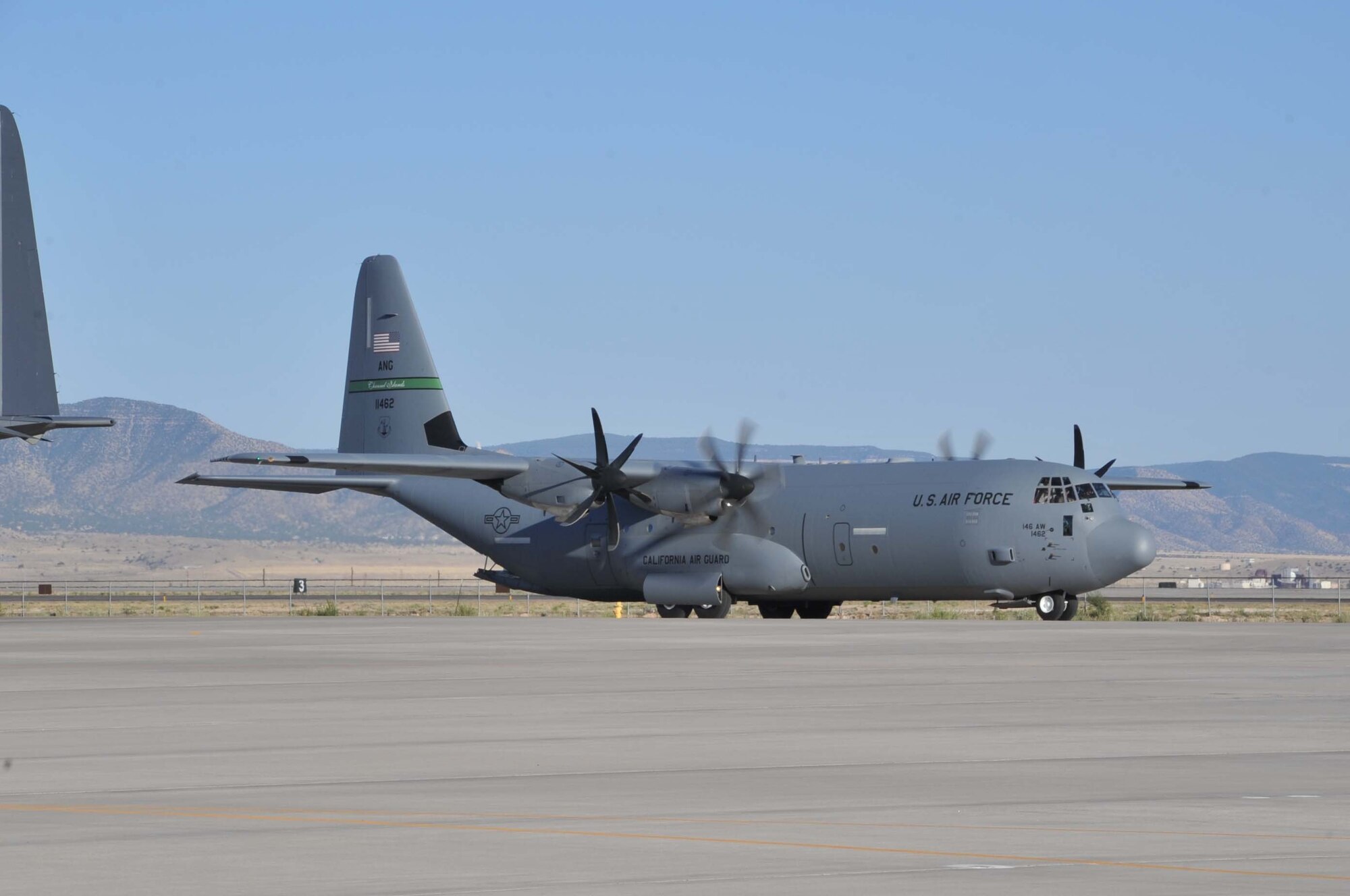 A C-130J from the California Air National Guard’s 146th Airlift Wing, Channel Islands Air National Guard Station, Calif., taxis to a parking spot June 15 after landing at Kirtland AFB, N.M. In support of the National Interagency Fire Center, the unit brought two C-130J aircraft equipped with the Modular Airborne Fire Fighting System to help control wildfires in the Southwestern U.S. (Air Force photo by Elizabeth Martinez.) 