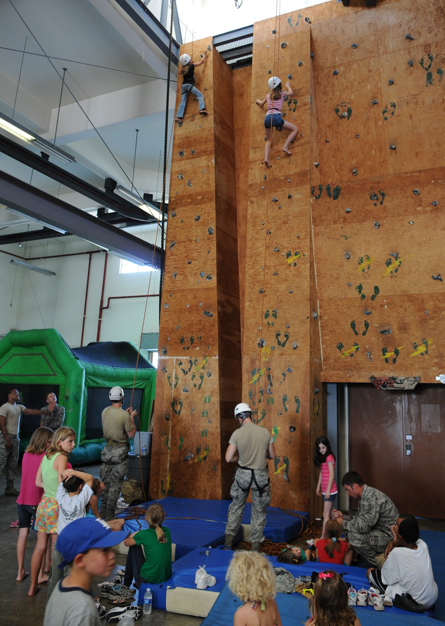 KADENA AIR BASE, Japan -- Children climb to the top of a rock climbing wall here June17 during the 353rd Special Operations Group Family Appreciation Day. Families from the 353rd SOG were treated to orientation flights, equipment displays and a brief Survival, Evasion, Resistance and Escape orientation during the event. (U.S. Air Force photo by Tech. Sgt. Aaron Cram)