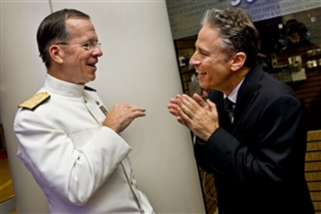 Navy Adm. Mike Mullen, chairman of the Joint Chiefs of Staff, speaks with Jon Stewart of "The Daily Show with Jon Stewart" at the Stand Up for Heroes dinner in Washington, D.C., June 16, 2011. The event, sponsored by the Bob Woodruff Foundation, brought together leaders from all walks of life to increase public awareness to help service members, veterans and their families.