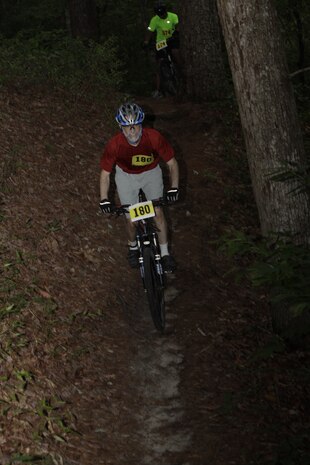Michael Reed, a psychologist from nearby New Bern, N.C., descends down one of the Piranha Pit bike trails aboard Cherry Point during the annual MCCS Mountain Bike Challenge June 18. The tree winding track was seven miles and featured numerous inclines and declines.
