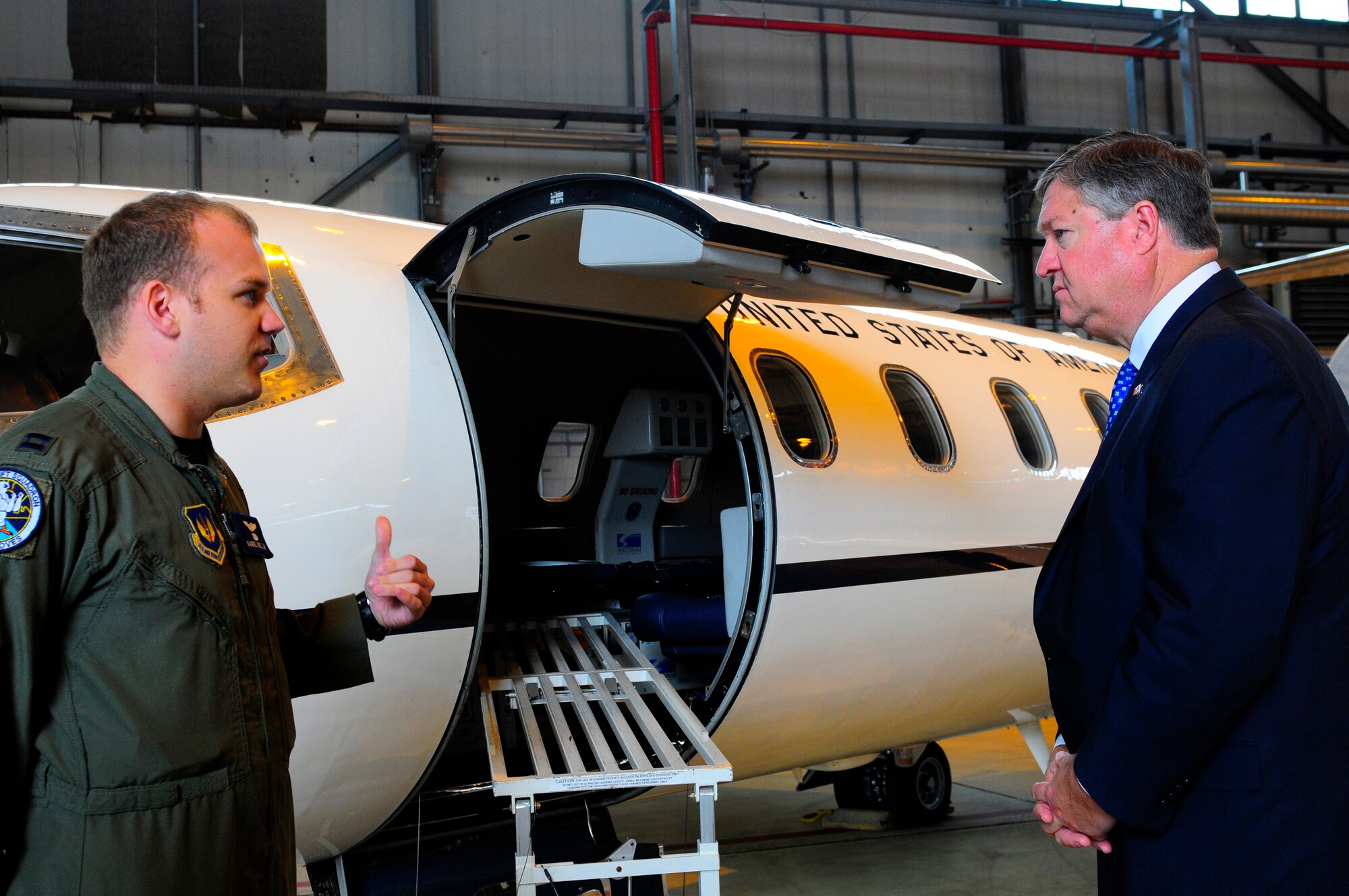 U.S. Air Force Capt. Daniel Helland, 76th Airlift Squadron, briefs the Secretary of the Air Force Michael Donley on C-21 aircraft aeromedical evacuation procedures on Ramstein Air Base, Germany, June 18, 2011. The secretary traveled to Europe to meet with Airmen and receive updates from command leadership on U.S. Air Forces Europe efforts to build partnership capacity and ongoing contingency support for Operation Unified Protector. (U.S. Air Force Photo by Airman 1st Class Brea Miller)