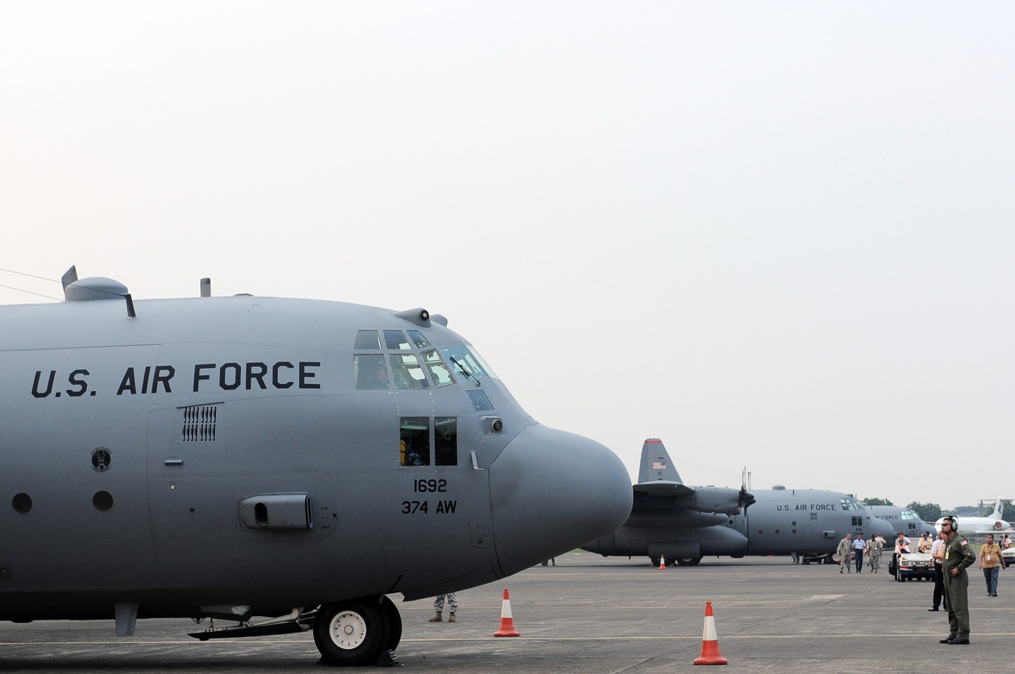 HALIM AIR BASE, Indonesia -- Three C-130 Hercules aircraft from the 36th Airlift Squadron at Yokota Air Base, Japan, sit ready to take part in Exercise Cope West 11 at Halim Air Base, Indonesia, June 18, 2011. The aircraft and more than 70 Yokota airmen, as well as one Indonesian Air Force C-130 will participate in the week-long bilateral field training exercise which is designed to enhance the readiness and combined interoperability between the U.S. and Indonesian Air Forces. (U.S. Air Force photo/Capt. Raymond Geoffroy)