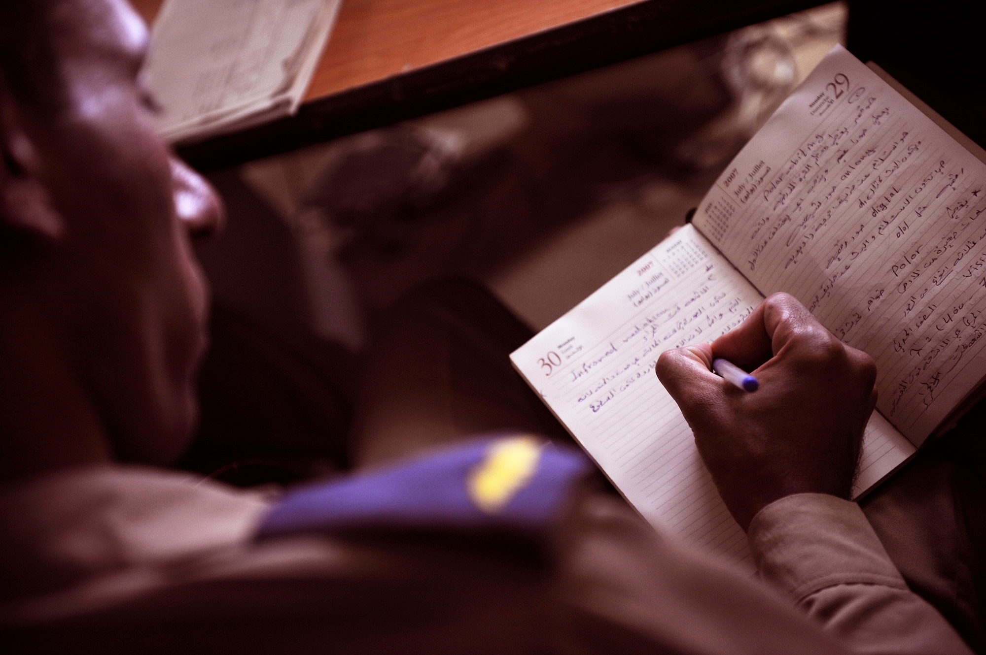 An Iraqi air force cadet takes notes during a weather course taught by Iraqi instructors at IqAF's weather center June 14. U.S. Air Force weather advisors have been training the initial cadre of IqAF's weather forecasters over the past three years. The training entered a new chapter of autonomy last month when IqAF’s cadre began teaching 18 new cadets at the weather center in Baghdad. (U.S. Air Force/Tech. Sgt. Jason Lake)