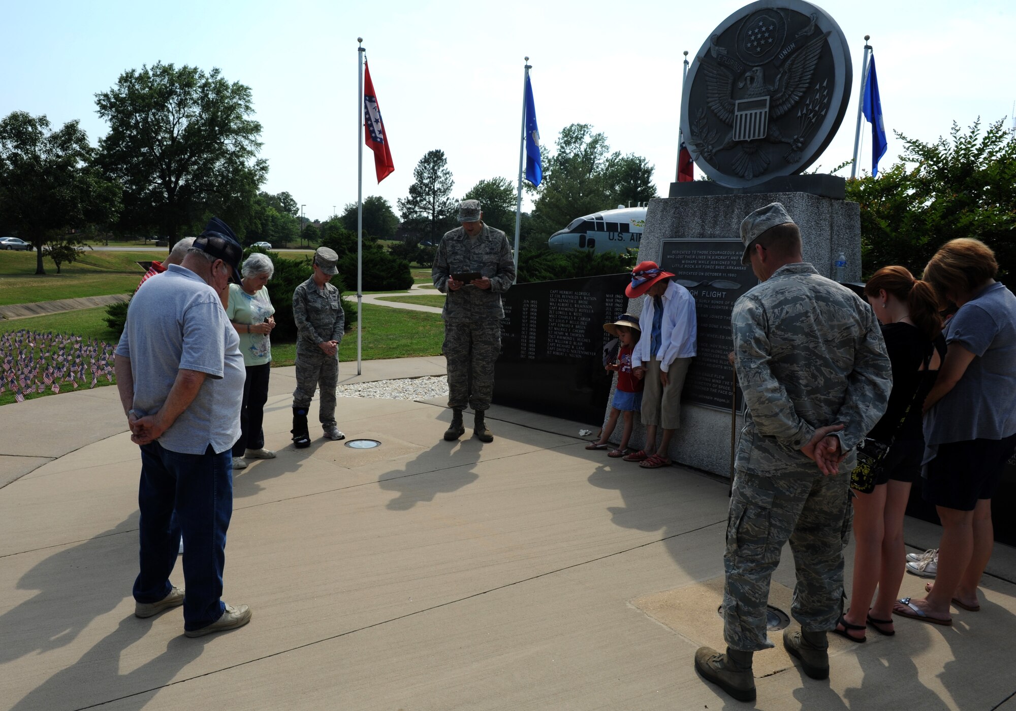 Team Little Rock members gather in a prayer circle during a National Flag Day ceremony June 14, 2011, at Little Rock Air Force Base, Ark. National Flag Day commemorates the adoption of the United States flag. (U.S. Air Force photo by Airman 1st Class Rusty Frank)