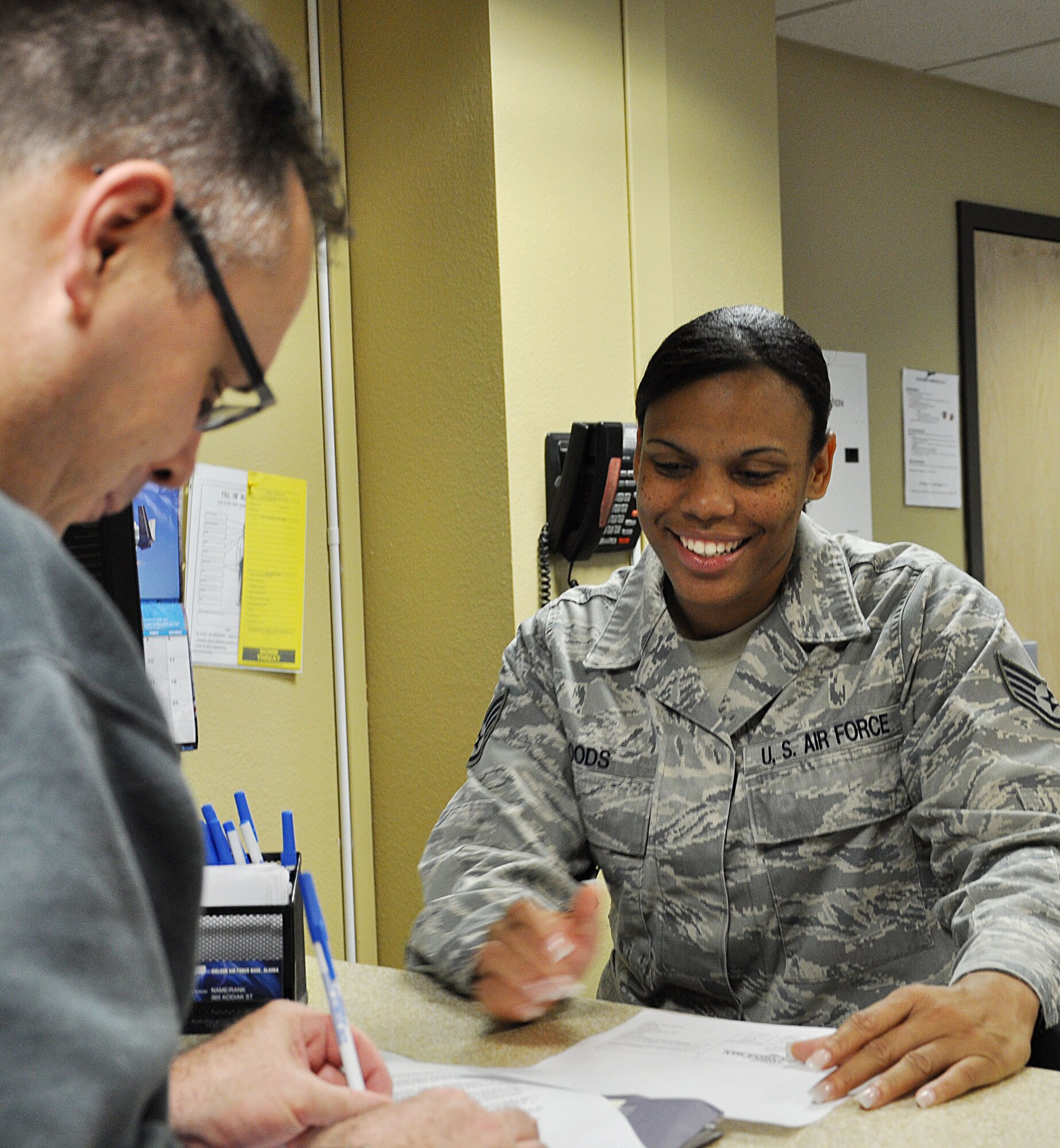 U.S. Air Force Staff Sgt. Talandra Woods, 18th Force Support Sqadron services journeyman, checks in a new guest at the Gold Rush Inn, June 20, 2011, at Eielson Air Force Base, Alaska. Sergeant Woods is forward deployed to Alaska from Kadena Air Base, Japan, in support of the Northern Edge Joint Premier Training Exercise. (U.S. Air Force photo by Staff Sgt. Amanda Dick)