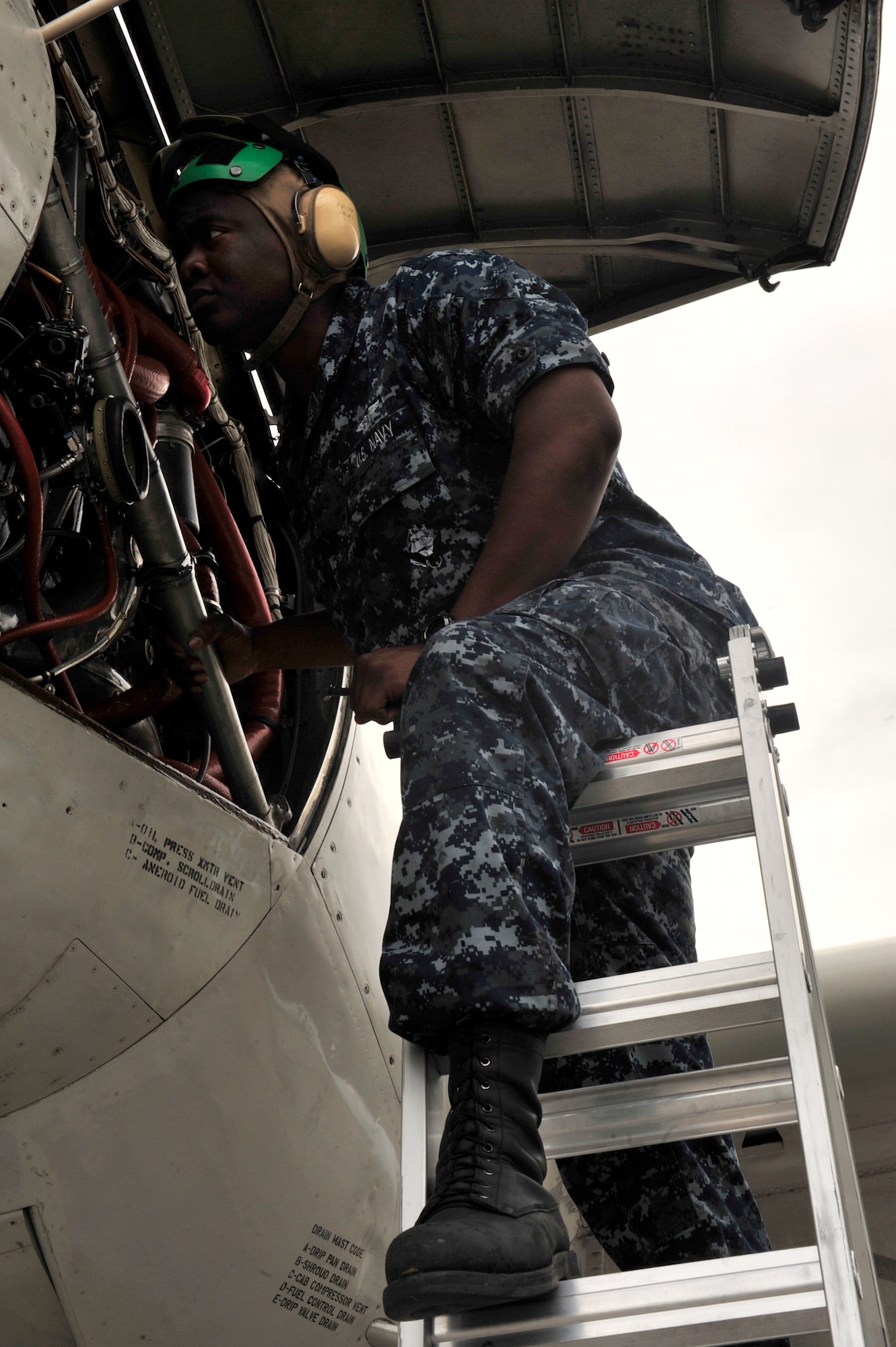 United States Navy Petty Officer 2nd Class Christopher Graham, an aviation mechanic with the U.S. Navy Patrol Squadron One, Whidbey Island, Washington performs post flight maintenance on a LSRS (P3) during the Northern Edge Premier Joint Training Exercise at Eielson Air Force Base, Alaska, June 20. This exercise emphasizes a mixture of joint forces for real world contingencies. (U.S. Air Force photo/ Staff Sgt. Lakisha A.Croley)