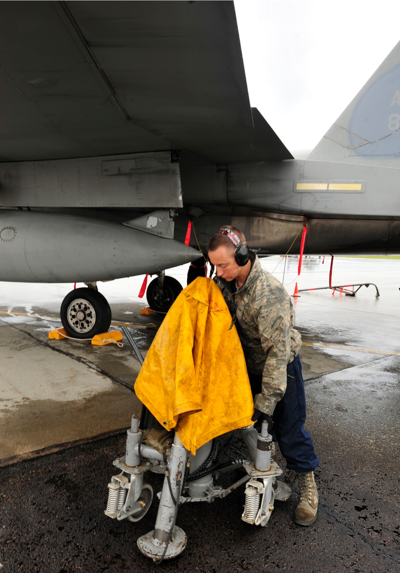 U.S. Air Force Airman 1st Class Cody Weller, a crew chief with the 18th Aircraft Maintenance Squadron, Kadena Air Base, Japan, completes a gear swings check on an F-15 Eagle during the Northern Edge Premier Joint Training Exercise at Eielson Air Force Base, Alaska, June 20.  Northern Edge first began in 1993, following a long tradition of exercises such as JACK FROST in 1975, BRIM FROST from 1981-1989 and Arctic Warrior from 1991-1992. (U.S. Air Force photo/ Staff Sgt. Lakisha A. Croley)