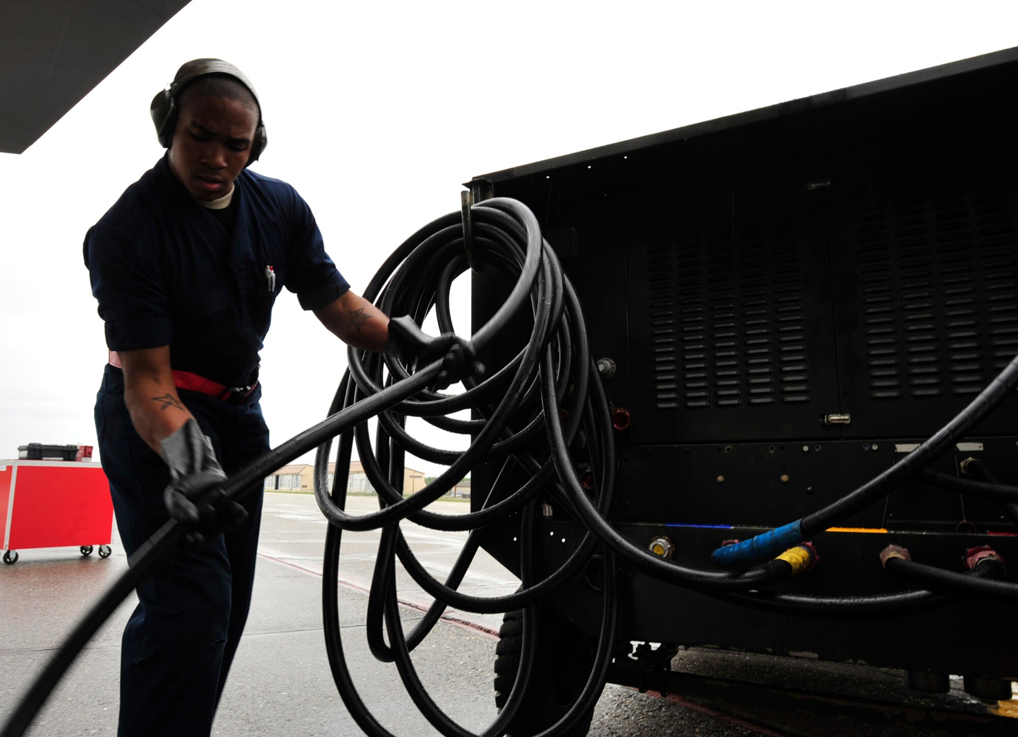 U.S. Air Force Airman 1st Class Christopher Hardy, a crew chief with the 18th Aircraft Maintenance Squadron, Kadena Air Base, Japan, disconnects a hydraulic test stand from an F-15 Eagle during the Northern Edge Premier Joint Training Exercise at Eielson Air Force Base, Alaska, June 20.  Thirty military units and more than 150 aircraft are participating in Northern Edge 2011. (U.S. Air Force photo/ Staff Sgt. Lakisha A. Croley)