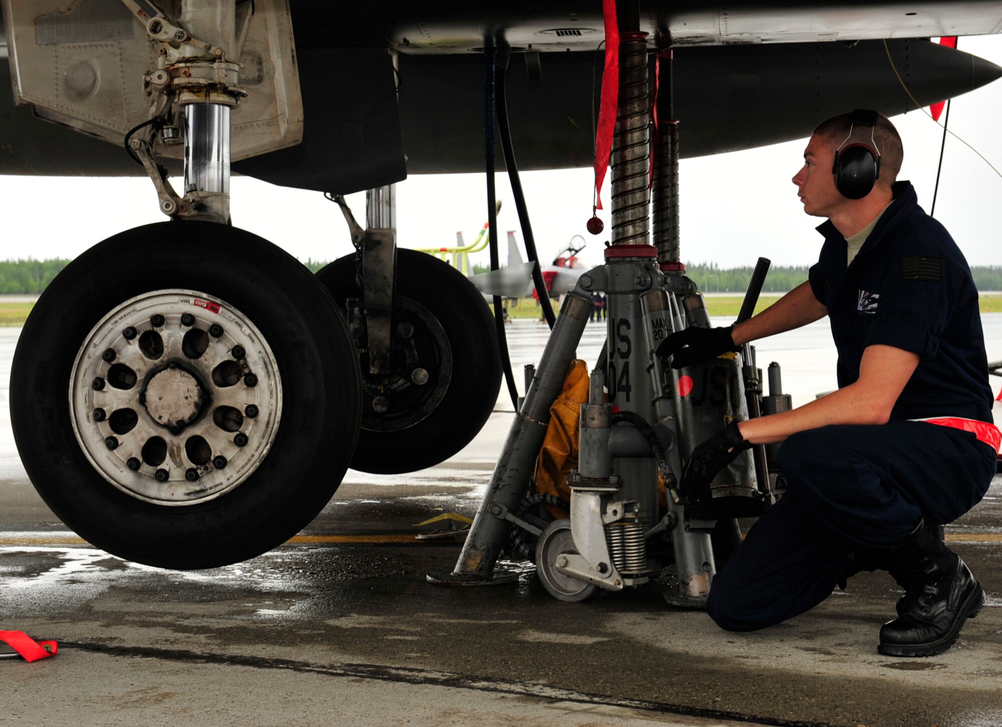 U.S. Air Force Senior Airman Greg Wright, a crew chief with the 18th Aircraft Maintenance, Kadena Air Base, Japan, performs a landing gear operations check on an F-15 Eagle during the Northern Edge Premier Joint Training Exercise at Eielson Air Force Base, Alaska, June 20. More than 1,000 personnel have been deployed to Alaska for the exercise and are established at the foremost Alaskan Army and Air Force installations. (U.S. Air Force photo/ Staff Sgt. Lakisha A. Croley)