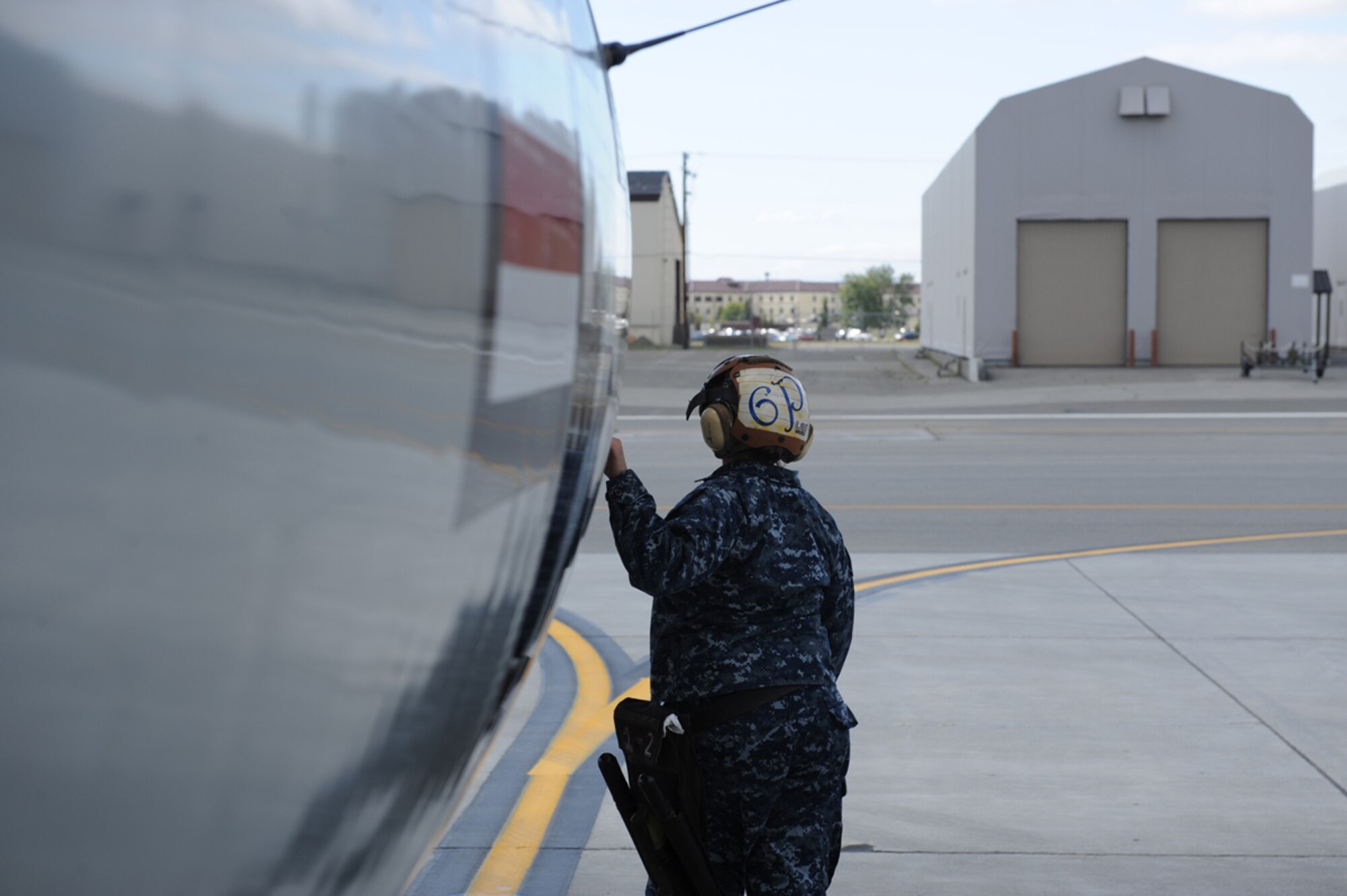 JOINT BASE ELMENDORF RICHARDSON, Alaska -- U.S. Navy Aviation Electronics Technician Airman Lisa Abel performs pre-flight maintenance checks during Exercise Northern Edge 11 in JBER, Alaska, June 16, 2011. Northern Edge, Alaska's largest military training exercise, is designed to prepare joint forces to respond to crises throughout the Asia-Pacific region. (Photo by Mass Communication Specialist 2nd Class Rufus Hucks)