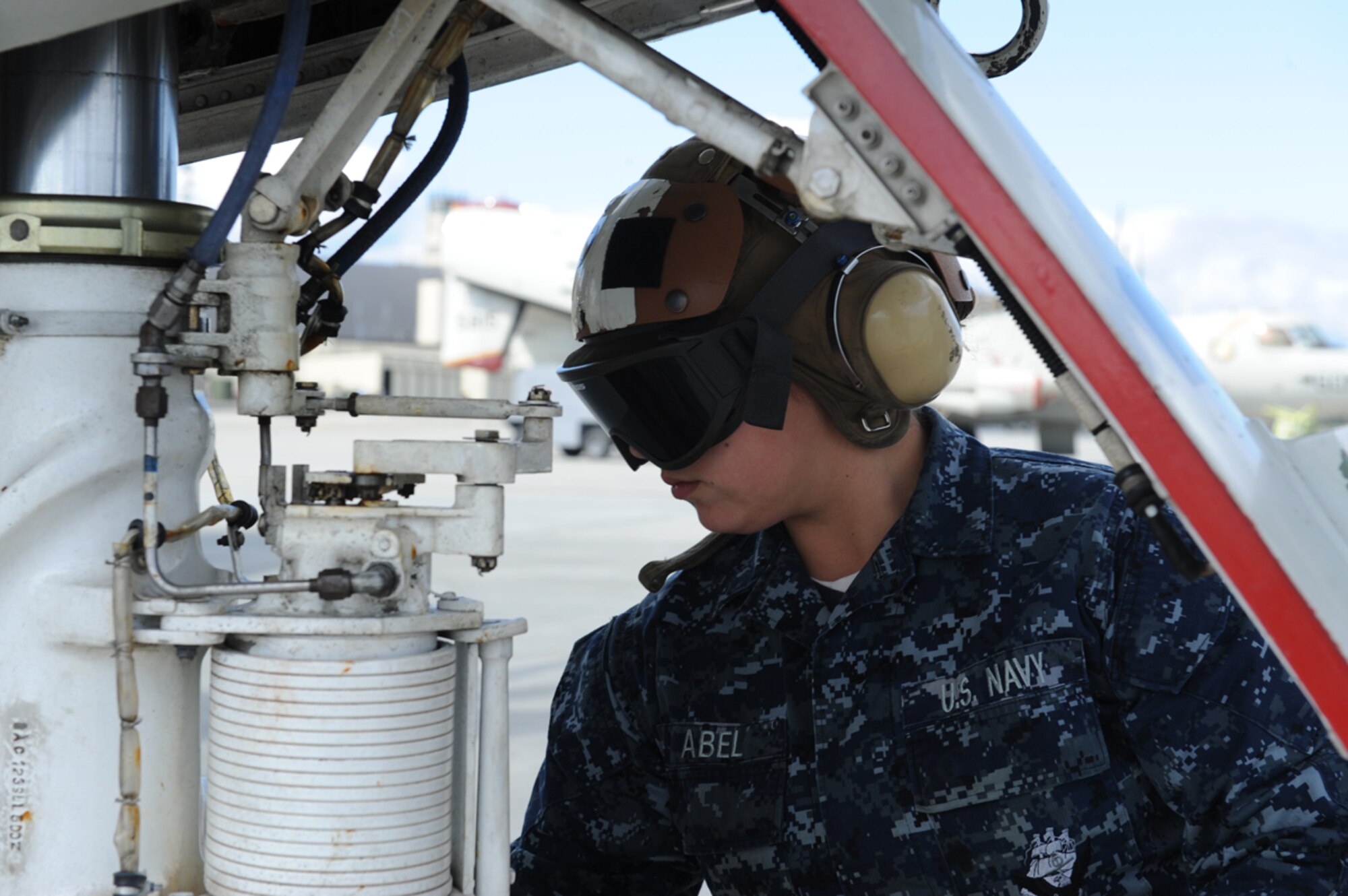 JOINT BASE ELMENDORF RICHARDSON, Alaska -- U.S. Navy Aviation Electronics Technician Airman Lisa Abel performs pre-flight maintenance checks during Exercise Northern Edge 11 in JBER, Alaska, June 16, 2011. Northern Edge, Alaska's largest military training exercise, is designed to prepare joint forces to respond to crises throughout the Asia-Pacific region. (Photo by Mass Communication Specialist 2nd Class Rufus Hucks)