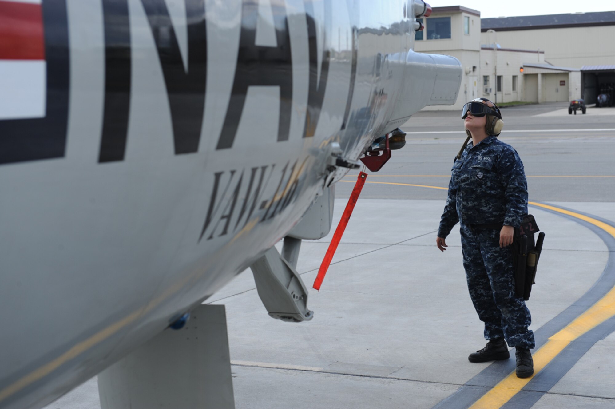 JOINT BASE ELMENDORF RICHARDSON, Alaska -- U.S. Navy Aviation Electronics Technician Airman Lisa Abel performs pre-flight maintenance checks during Exercise Northern Edge 11 in JBER, Alaska, June 16, 2011. Northern Edge, Alaska's largest military training exercise, is designed to prepare joint forces to respond to crises throughout the Asia-Pacific region. (Photo by Mass Communication Specialist 2nd Class Rufus Hucks)