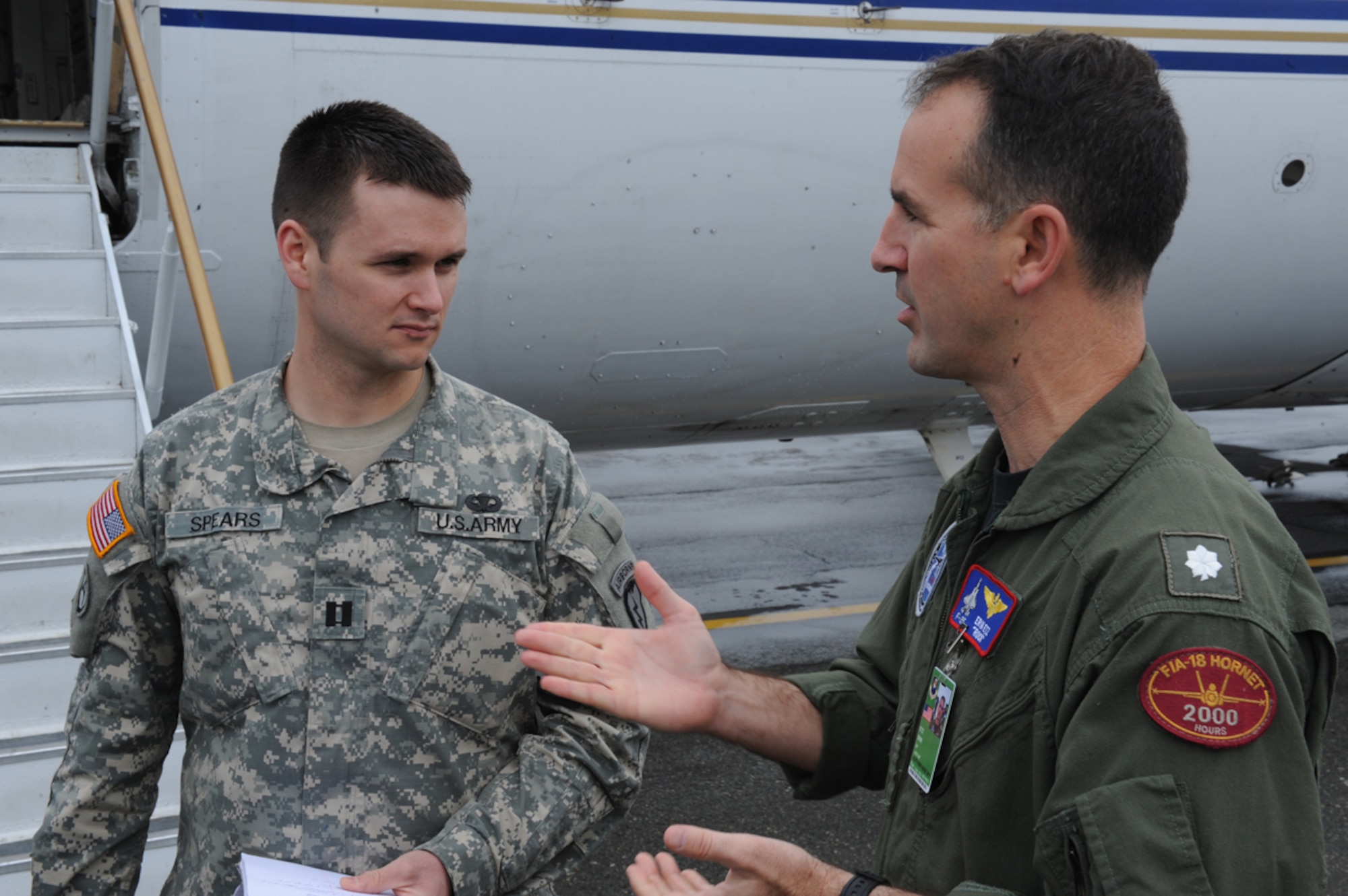 JOINT BASE ELMENDORF RICHARDSON, Alaska --  Navy Cmdr. Erik Etz speaks to U.S. Army Capt. Charles Spears about the capabilities of the F-35 Joint Strike Fighter sensor in JBER, Alaska, June 14, 2011. The sensor was brought to Alaska for testing during Exercise Northern Edge 11, Alaska's largest military training exercise. The exercise is designed to prepare joint forces to respond to crises throughout the Asia-Pacific region. (Photo by Mass Communication Specialist 2nd Class Rufus Hucks)