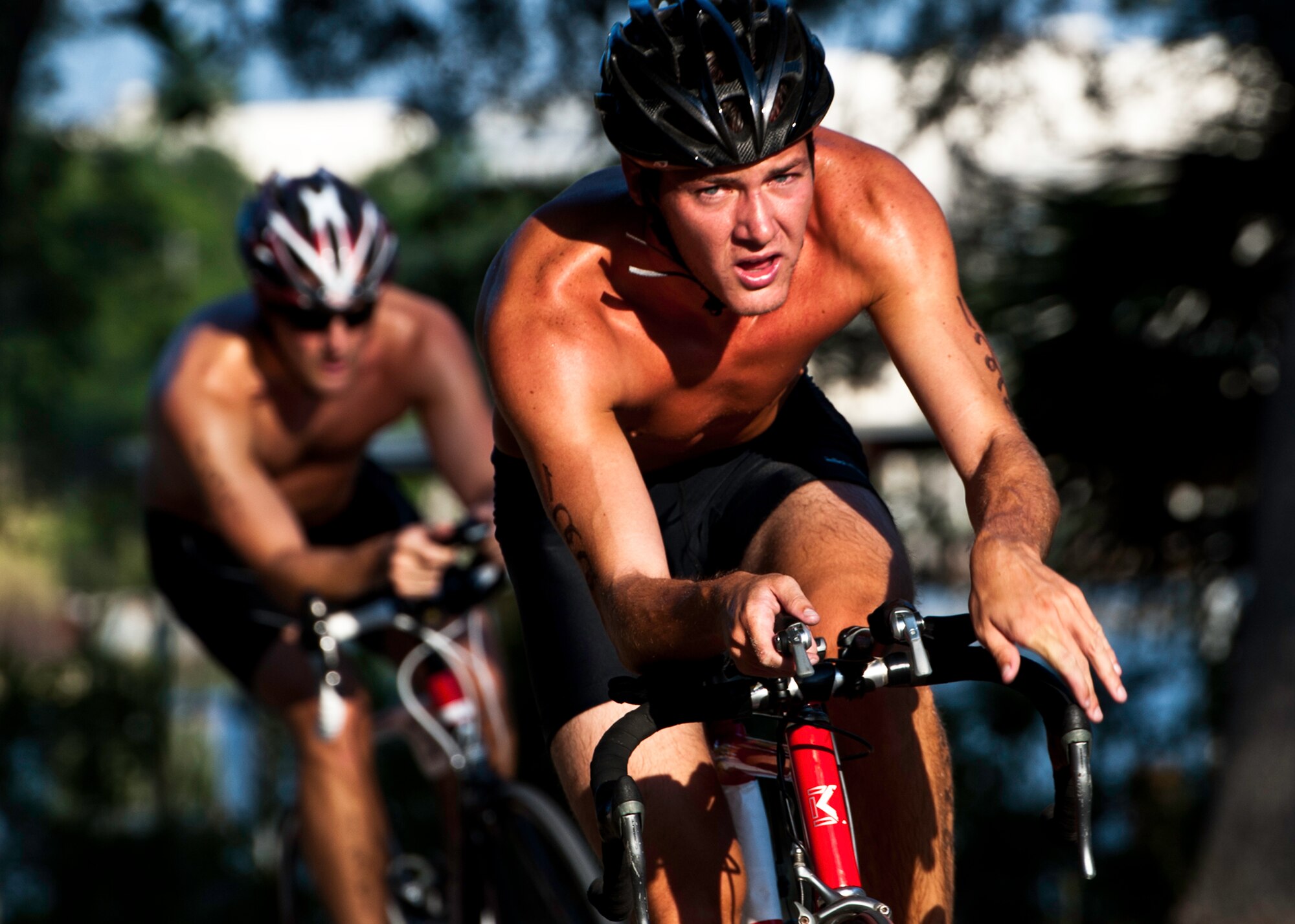 Tyler Hall heads toward the finish of the bike ride at this year’s “My First Tri” triathlon at Eglin Air Force Base Fla., June 18.  Almost 350 people of all ages “tried” at the 12th annual event.  The triathlon consists of a 200-meter swim, eight-mile bike ride, then a 2.5-mile run.  Hall was ninth overall finishing at 44 minutes and 13 seconds. (U.S. Air Force photo/Samuel King Jr.)
