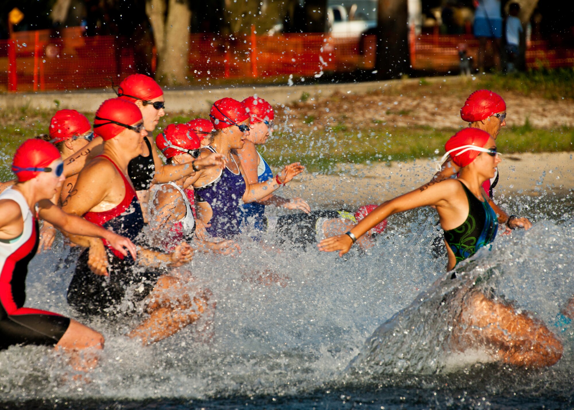 Women charge through the water for as far as they can before they begin to swim during this year’s “My First Tri” triathlon at Eglin Air Force Base Fla., June 18.  Almost 350 people of all ages “tried” at the 12th annual event.  The triathlon consists of a 200-meter swim, eight-mile bike ride, then a 2.5-mile run.  David Shearon finished with the best overall time - 39 minutes 24 seconds.  Wendy Ewing had the best time for females with 47 minutes 39 seconds.  (U.S. Air Force photo/Samuel King Jr.)