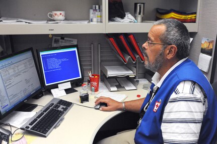 Joe Harris, Red Cross Volunteer, works customer service at the optical clinic at Randolph AFB June 16  (U.S. Air Force photo/Rich McFadden) (released)
