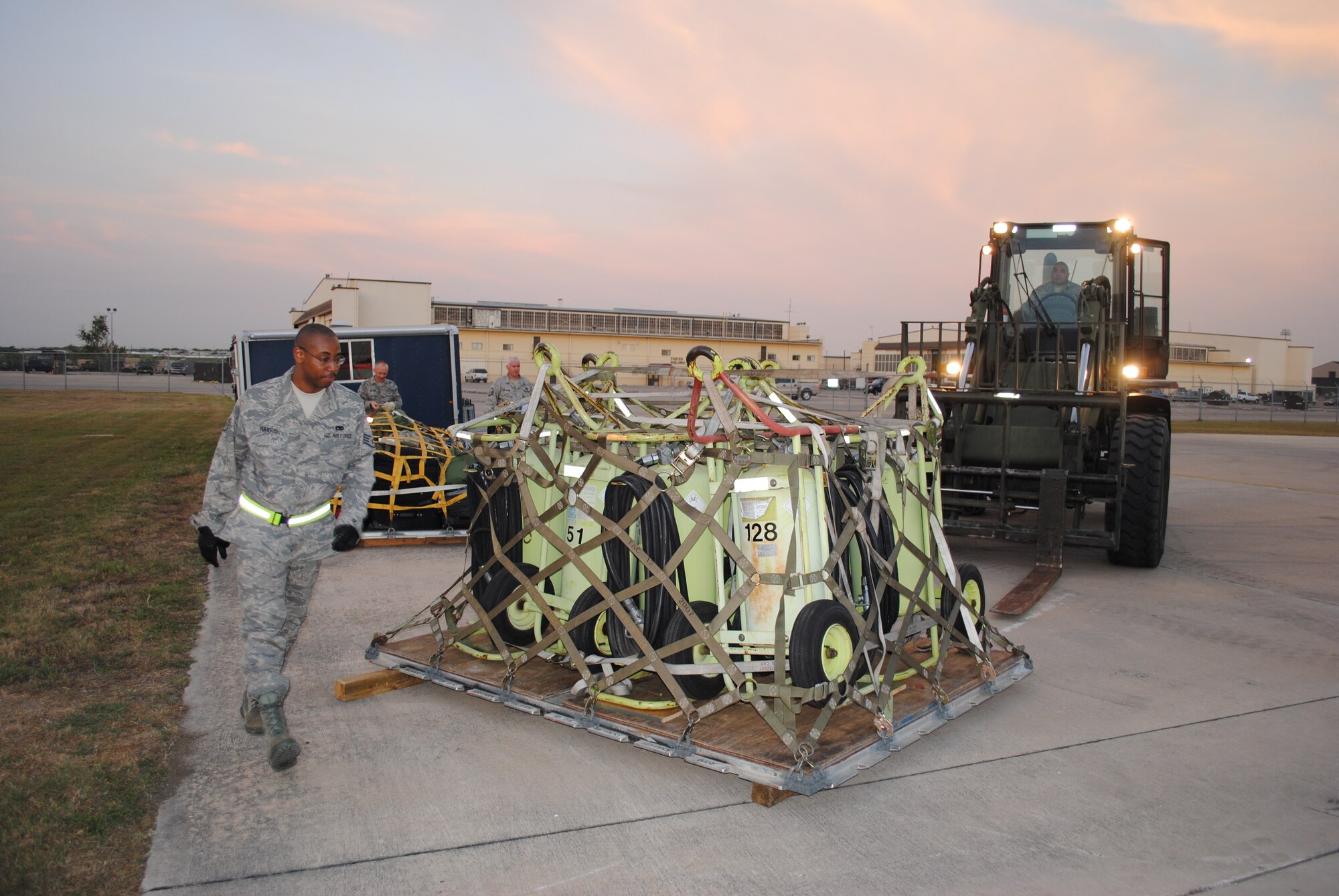 Staff Sgt. Willie Harris completes a final visual inspection as Staff Sgt. Rowland Ramos drives in a 10K forklift to transport a group of industrial strength fire extinguishers on a pallete to a C-5 Galaxy. The plane is scheduled to depart from Lackland Air Force Base, Texas, April 13, 2011, in support of Patriot Hook 2011.
 
Patriot Hook is a large-scale air mobility exercise involving Air Force Reserve Command airlift control flights, flying units and aerial port personnel. Exercise participants conduct deployment-type operations from three primary locations California; North Island Naval Air Station, Point Mugu and Naval Auxiliary Landing Field San Clemente Island. (U.S. Air Force photo/Senior Airman Luis Loza Gutierrez)