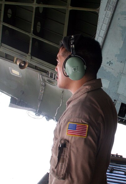 Staff Sgt. Angelo Dumanhog, C-5 Galaxy loadmaster, works near a C-5M Super Galaxy on June 6, 2011, at Bagram Airfield, Afghanistan. He was doing his work after being a part of the aircrew who completed the first direct delivery airlift mission through the Arctic Circle from Dover Air Force Base, Del., to Bagram Airfield June 5-6, 2011. Sergeant Dumanhog was one of 14 crewmembers who flew the mission. He is from the 9th Airlift Squadron at Dover AFB and his hometown is Lemoore, Calif.  (U.S. Air Force Photo/Master Sgt. Scott T. Sturkol)