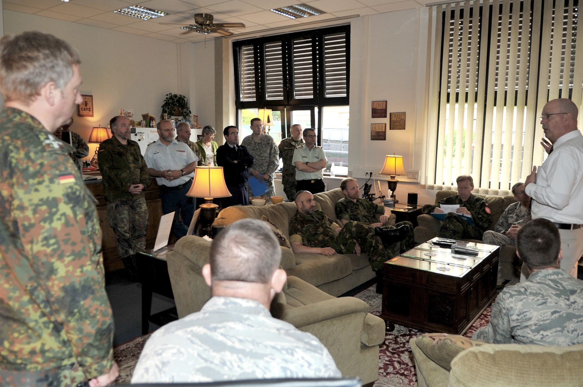 Rick Deppe (right), the Airmen Ministries coordinator for Club 7, briefs Chaplain (Maj. Gen.) Cecil R. Richardson and other NATO chaplains June 16, 2011, during the NATO Allied Air Force Chaplains Consultative Committee Conference at Ramstein Air Base, Germany. Chaplain Richardson is the U.S. Air Force chief of chaplains. (U.S. Air Force photo/Senior Airman Caleb Pierce) 