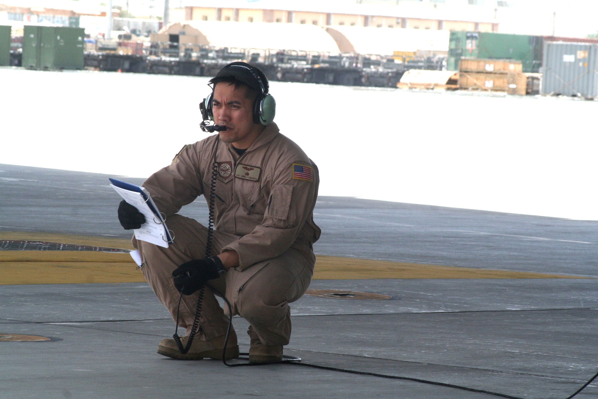 Staff Sgt. Angelo Dumanhog, C-5 Galaxy loadmaster, works near a C-5M Super Galaxy on June 6, 2011, at Bagram Airfield, Afghanistan. He was doing his work after being a part of the aircrew who completed the first direct delivery airlift mission through the Arctic Circle from Dover Air Force Base, Del., to Bagram Airfield June 5-6, 2011. Sergeant Dumanhog was one of 14 crewmembers who flew the mission. He is from the 9th Airlift Squadron at Dover AFB and his hometown is Lemoore, Calif.  (U.S. Air Force Photo/Master Sgt. Scott T. Sturkol)