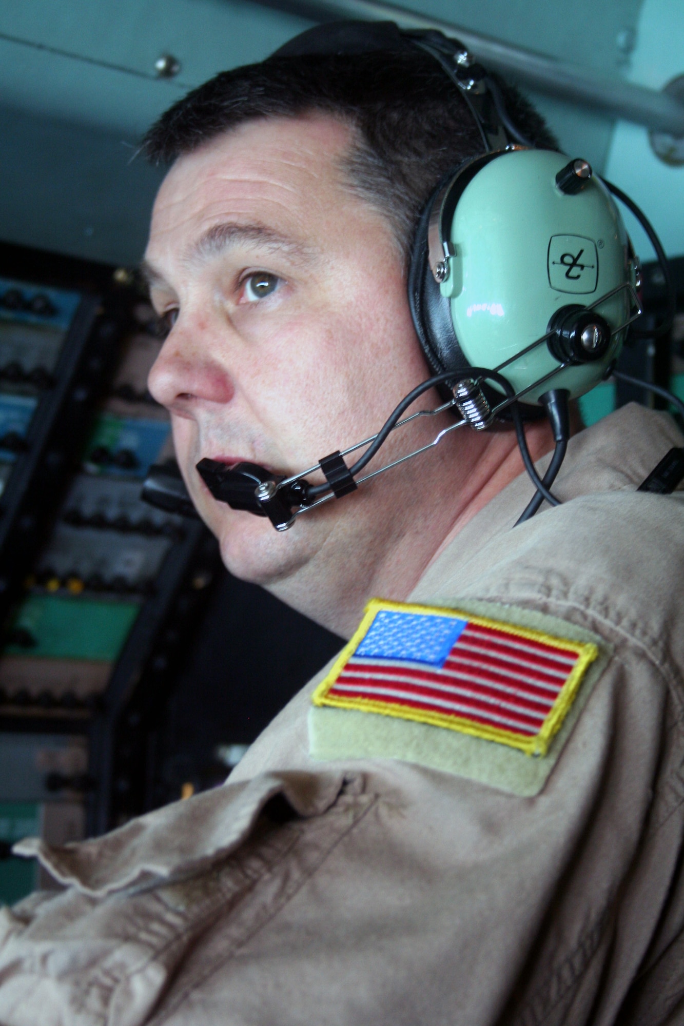 Senior Master Sgt. William Johnson, C-5 flight engineer, works in a  C-5M Super Galaxy during the Air Force's first direct delivery airlift mission from the United  States to Afghanistan on June 5, 2011. Sergeant Johnson, from the 9th Airlift Squadron, was one of 14 crewmembers who flew from Dover Air Force Base, Del., to Bagram Airfield, Afghanistan. (U.S. Air Force Photo/Master Sgt. Scott T. Sturkol)