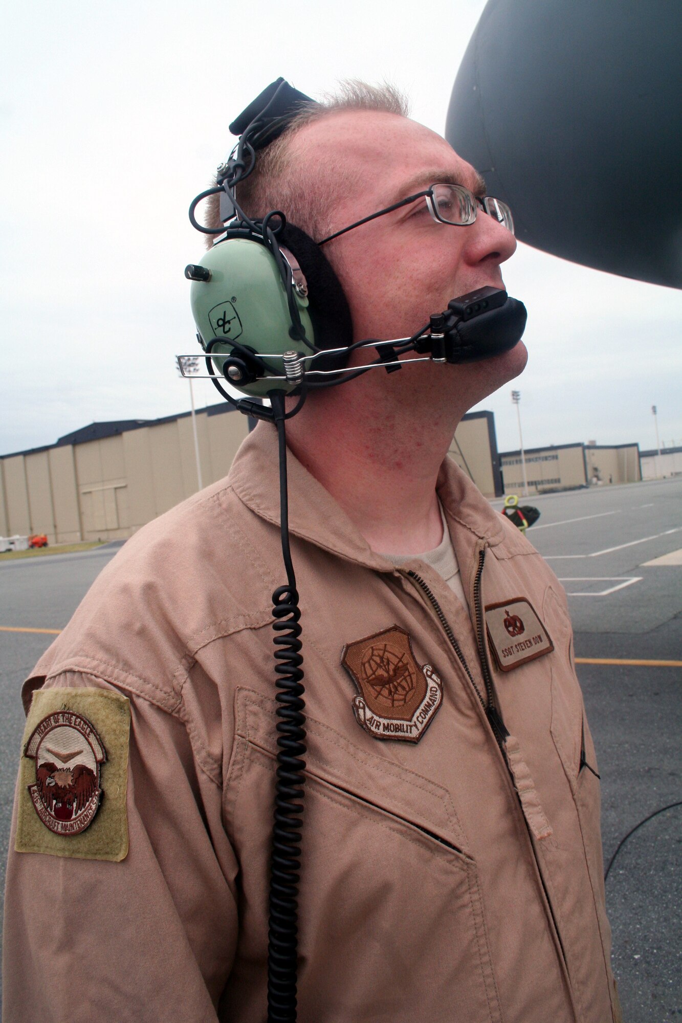 Staff Sgt. Steven Dow, C-5 Galaxy flying crew chief, works near a C-5M Super Galaxy on June 5, 2011, at Dover Air Force Base, Del. Sergeant Dow was part of the aircrew who completed the first direct delivery airlift mission through the Arctic Circle from Dover Air Force Base to Bagram Airfield, Afghanistan, on June 5-6, 2011. He is from the 436th Aircraft Maintenance Squadron at Dover AFB.  (U.S. Air Force Photo/Master Sgt. Scott T. Sturkol)