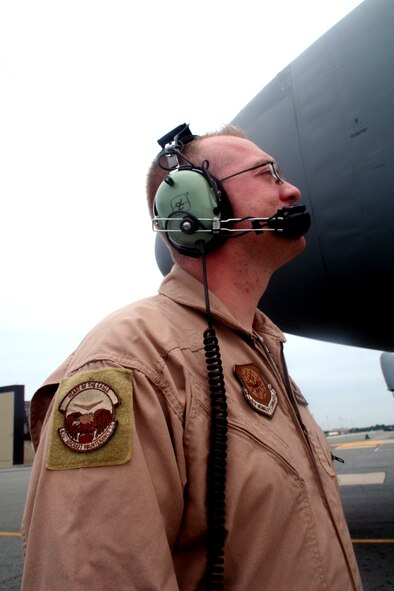 Staff Sgt. Steven Dow, C-5 Galaxy flying crew chief, works near a C-5M Super Galaxy on June 5, 2011, at Dover Air Force Base, Del. Sergeant Dow was part of the aircrew who completed the first direct delivery airlift mission through the Arctic Circle from Dover Air Force Base to Bagram Airfield, Afghanistan, on June 5-6, 2011. He is from the 436th Aircraft Maintenance Squadron at Dover AFB.  (U.S. Air Force Photo/Master Sgt. Scott T. Sturkol)