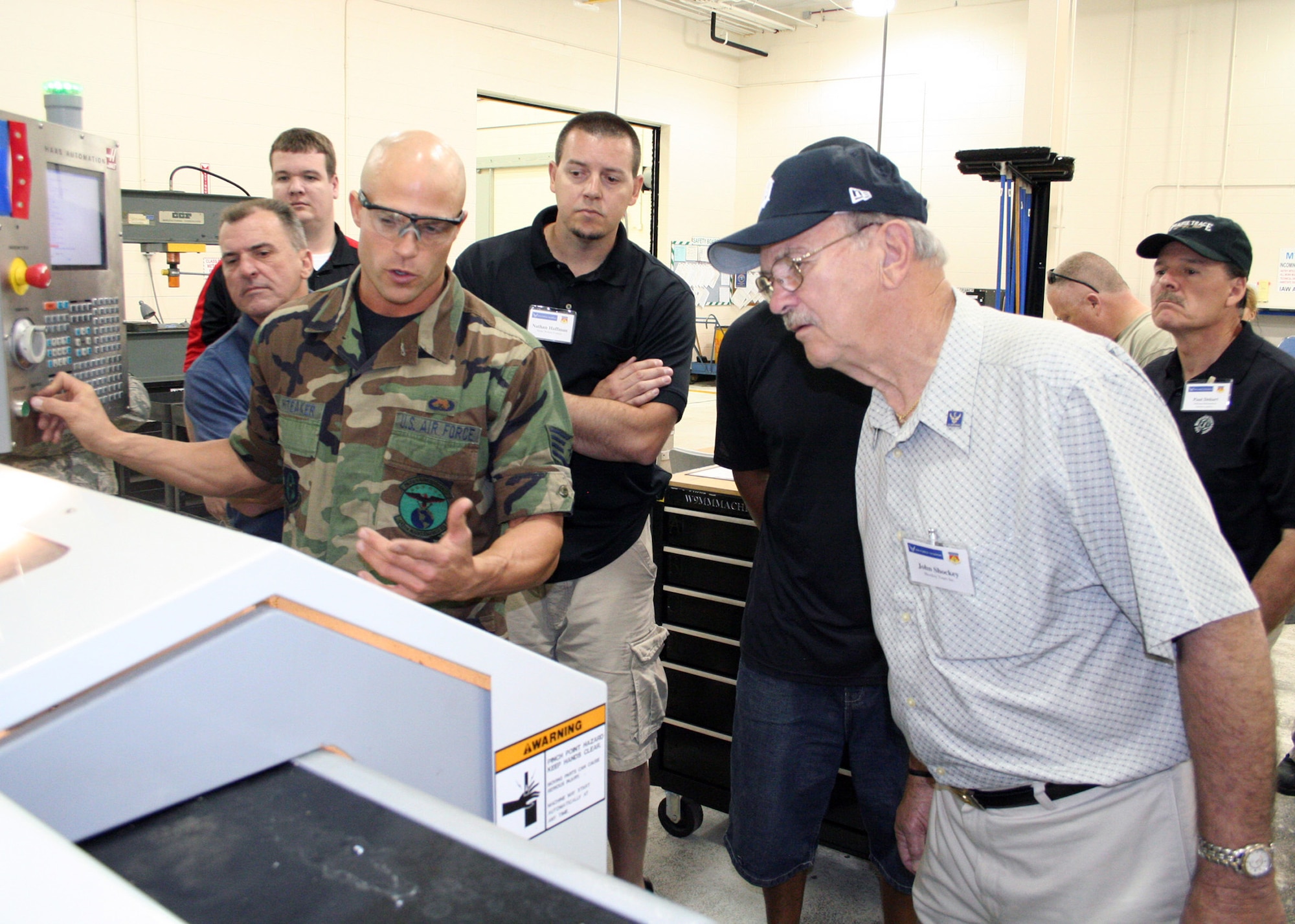 WRIGHT-PATTERSON AFB, Ohio—Staff Sgt. Eric Whiteaker, 445th Maintenance Squadron metals technology journeyman, demonstrates new technology to employer's attending the 445th Airlift Wing Employers AppreciationDay June 4. (U.S. Air Force photo/Senior Airman Matthew Cook)