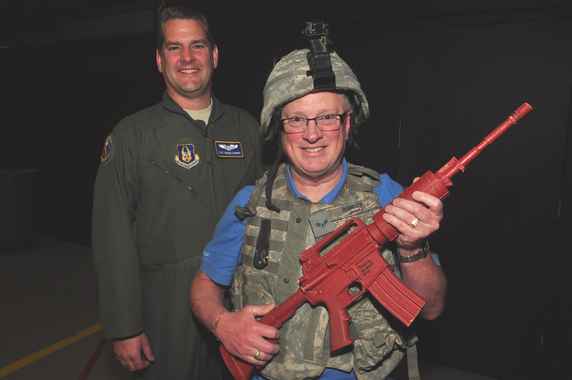 WRIGHT-PATTERSON AIR FORCE BASE, Ohio – Tech. Sgt. Thomas Shannon, 445th Aeromedical Evacuation Squadron AE technician, enjoys time with his employer, Michael Bennett, Bayer Animal Hospital, at the security forces display during Employer Appreciation Day June 4. (U.S. Air Force photo/Senior Airman Mikhail Berlin)