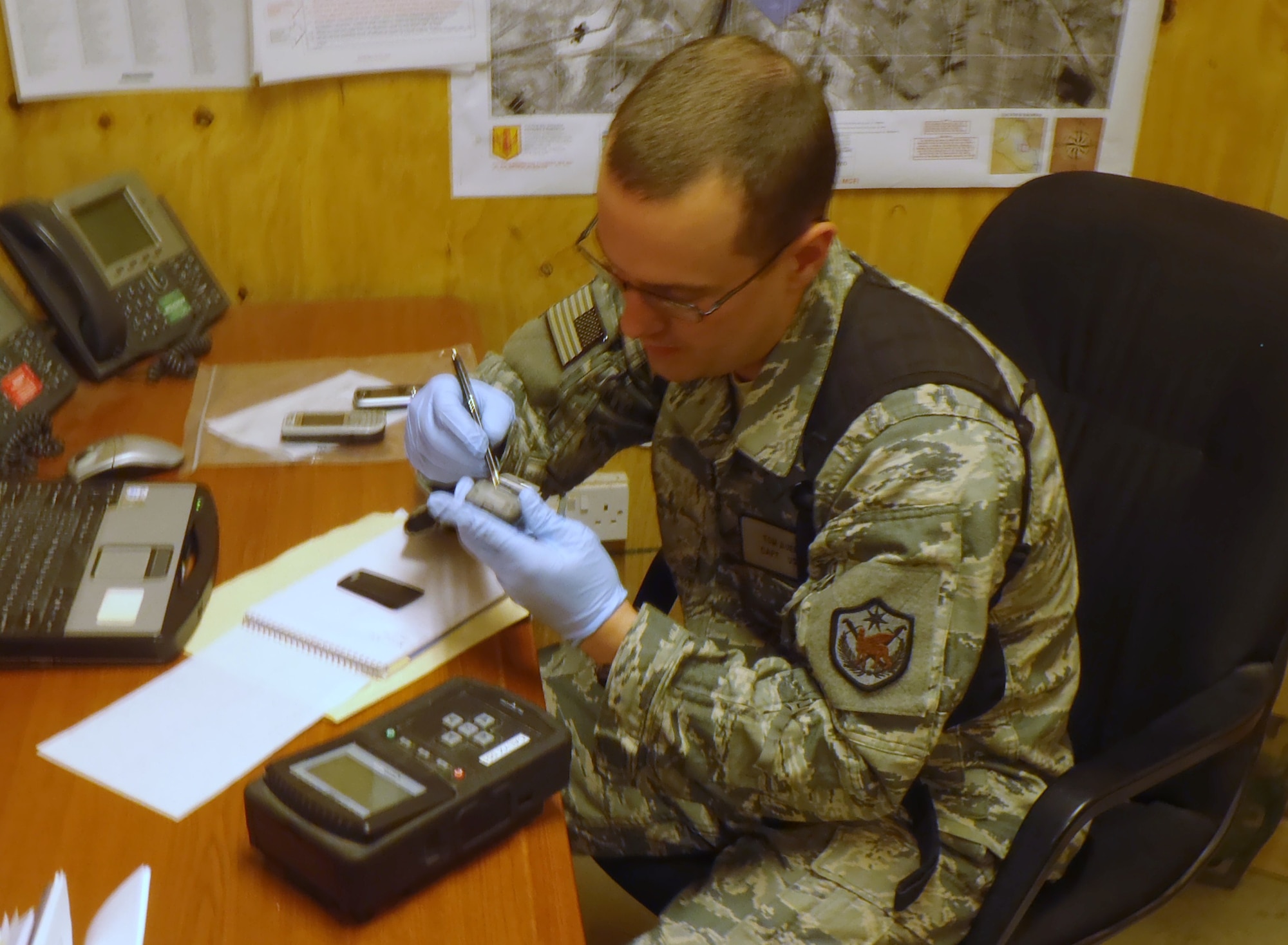 Capt. Tom Auers is deployed from the 36th Intelligence Squadron to the 467th Expeditionary Intelligence Squadron, Contingency Operating Base Delta, Iraq, where he serves as the COB Delta document and media exploitation officer in charge. Captain Auers manages captured enemy materials, including ID cards, documents, cell phones, computers and other various devices, and analyzes data contained therein to aid counterintelligence, force protection and judicial system efforts. (Photo Courtesy/Capt. Tom Auers)
