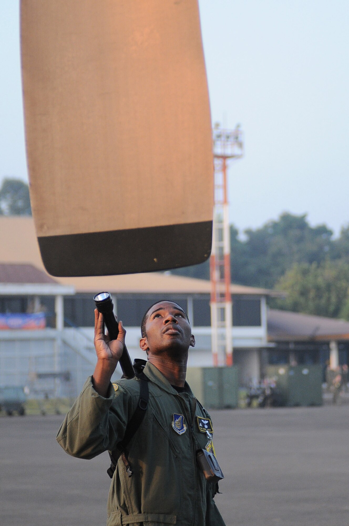 HALIM AIR BASE, Indonesia -- Staff Sgt. Bobby Jones, a flight engineer with the 36th Airlift Squadron at Yokota Air Base, Japan, inspects a Yokota C-130 Hercules prior to its first mission in Exercise Cope West 11 at Halim Air Base, Indonesia, June 20, 2011. During the exercise, U.S. and Indonesian Airmen exchange airlift, air-land, and airdrop delivery techniques to enhance readiness and combined interoperability between both Air Forces. (U.S. Air Force photo/Capt. Raymond Geoffroy)