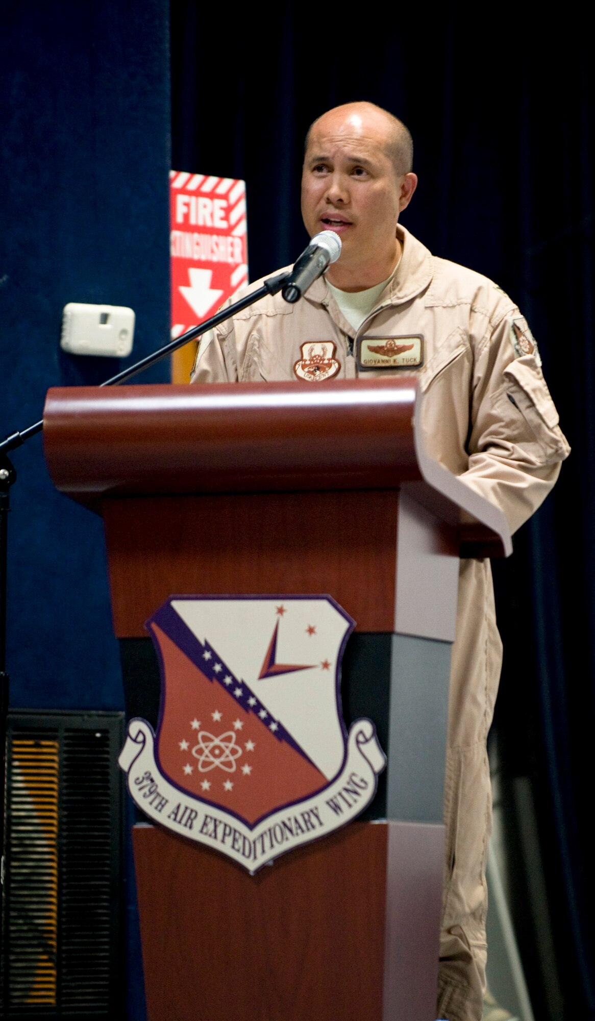 Col. Giovanni K. Tuck, 379th Air Expeditionary Wing commander, speaks during a change of command ceremony in which he assumed command, June 20, in Southwest Asia. Colonel Tuck assumed command of one of the largest and busiest air expeditionary wings in the world, saying, " We have the awesome responsibility to accomplish the mission that we are given and have a solemn obligation to take extraordinary care of America's sons and daughters who are placed in our charge."  (U.S. Air Force photo/Senior Airman Paul Labbe)