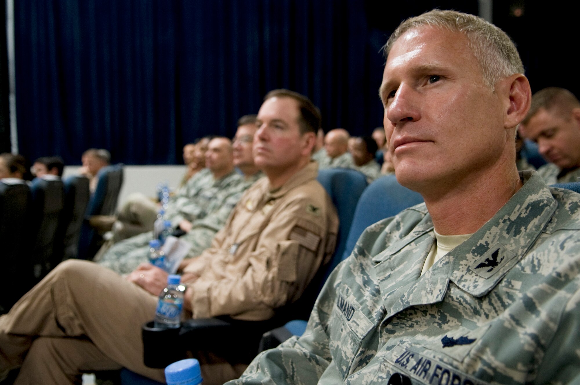 Col. David L. Almand, Air Mobility Division director, observes the 379th Air Expeditionary Wing change of command, June 20, in Southwest Asia. Col. Giovanni K. Tuck assumed command of the 379th AEW from Brig. Gen. Randy A. Kee. (U.S. Air Force photo/Senior Airman Paul Labbe)
