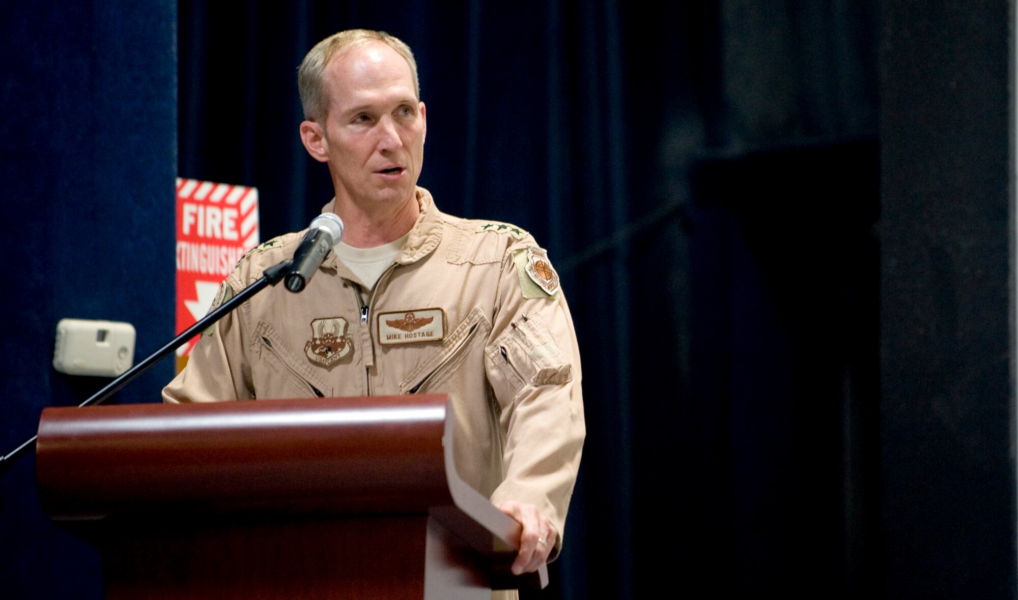 Lt. Gen. Mike Hostage, U.S. Air Forces Central commander, speaks to Col. Giovanni K. Tuck during remarks at the 379th Air Expeditionary Wing change of command June 20 in Southwest Asia. " I know you understand the 379th Wing's important mission," General Hostage said. "You are the right man for the job. Lead these Airmen well." (U.S. Air Force photo/Senior Airman Paul Labbe)