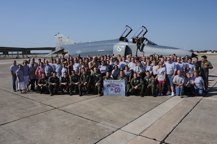 Members of the 81st Tactical Fighter Squadron (Wild Weasels) pose with members of the 435th Flying Training Squadron for a group photo on the flightline on Randolph Air Force Base June 17, 2011.  The photo was taken in honor of the 81st TFS reunion, sponsored by the 435th FTS. (U.S. Air Force photo/Rich McFadden) (released)