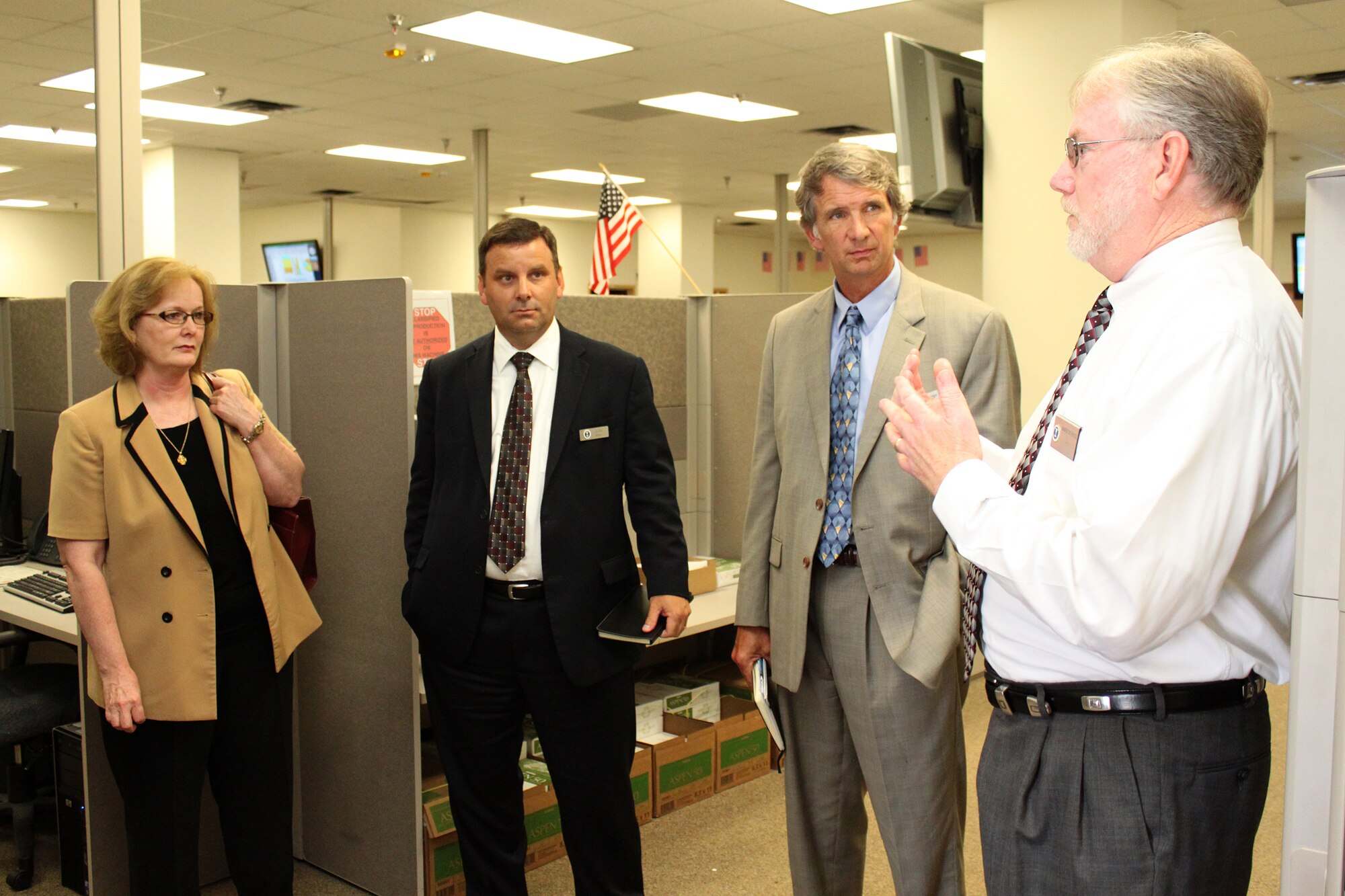 (From left to right) Carolyn Lee, the Air Force's senior advisor for the manpower, personnel and services' plans and integration directorate, Joe Thele, Air Force Personnel Operations Agency director, Bob Berger, AFPOA personnel systems operations director, listen to Bob Bushnell, AFPOA production operations division chief, discuss the capabilities of the Personnel Systems Operations Control Center June 14 at Randolph Air Force Base, Texas. (U.S. Air Force photo/Tech. Sgt. Steve Grever)