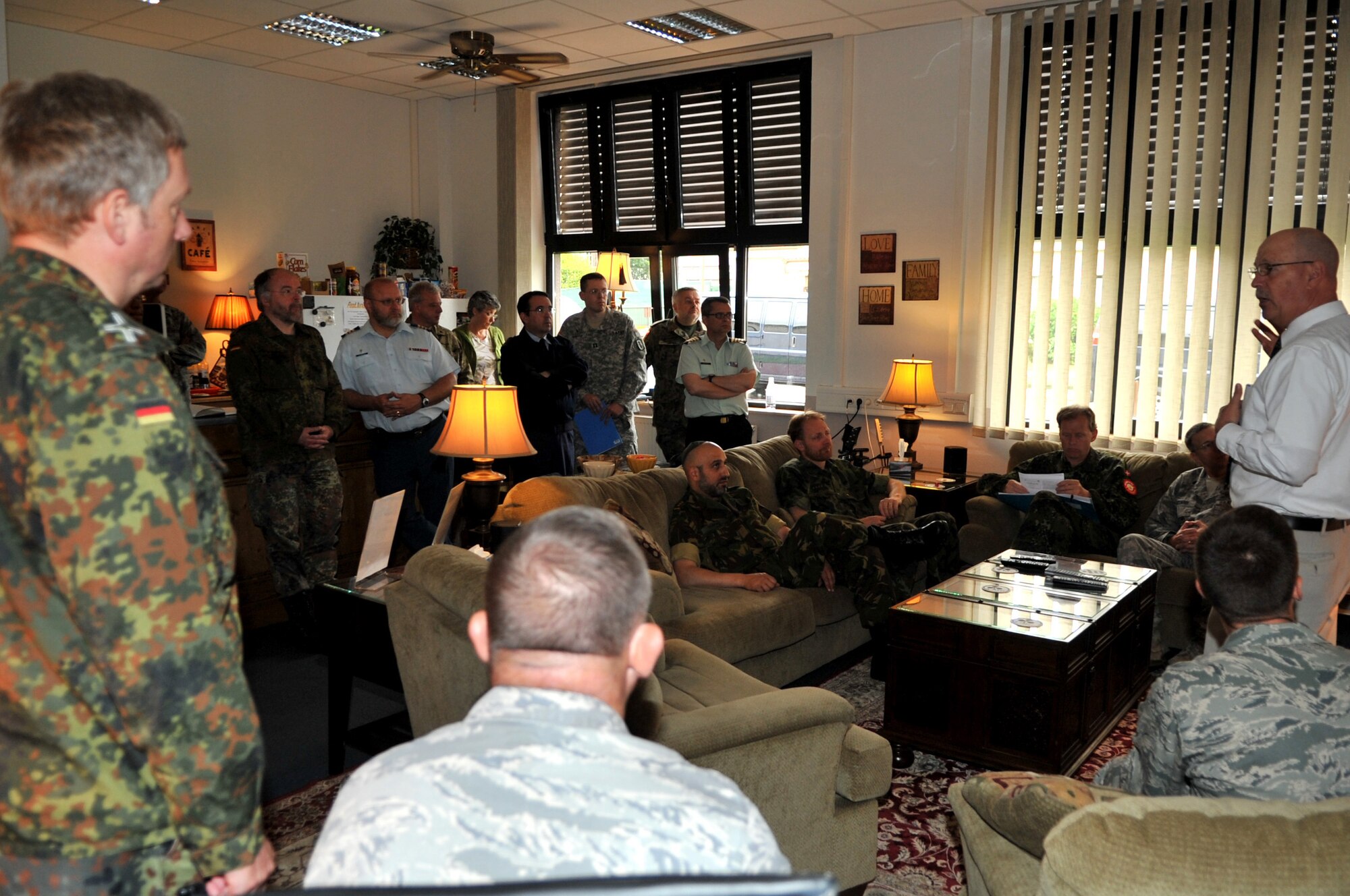 Rick Deppe, Airmen Ministries Coordinator for Club 7, briefs Chaplain, Maj. Gen. Cecil Richardson, Chief of Chaplains and other NATO chaplains about Club 7 Airmen ministries during the NATO Allied Air Force Chaplains Consultative Committee Conference 2011, Ramstein Air Base, Germany, June 16, 2011. The AAFCCC celebrated the 60th consecutive meeting with the theme, Warrior Care, focusing on providing Airmen and their families with the necessary skills to ensure spiritual fitness and resiliency. (U.S. Air Force photo by Senior Airman Caleb Pierce)