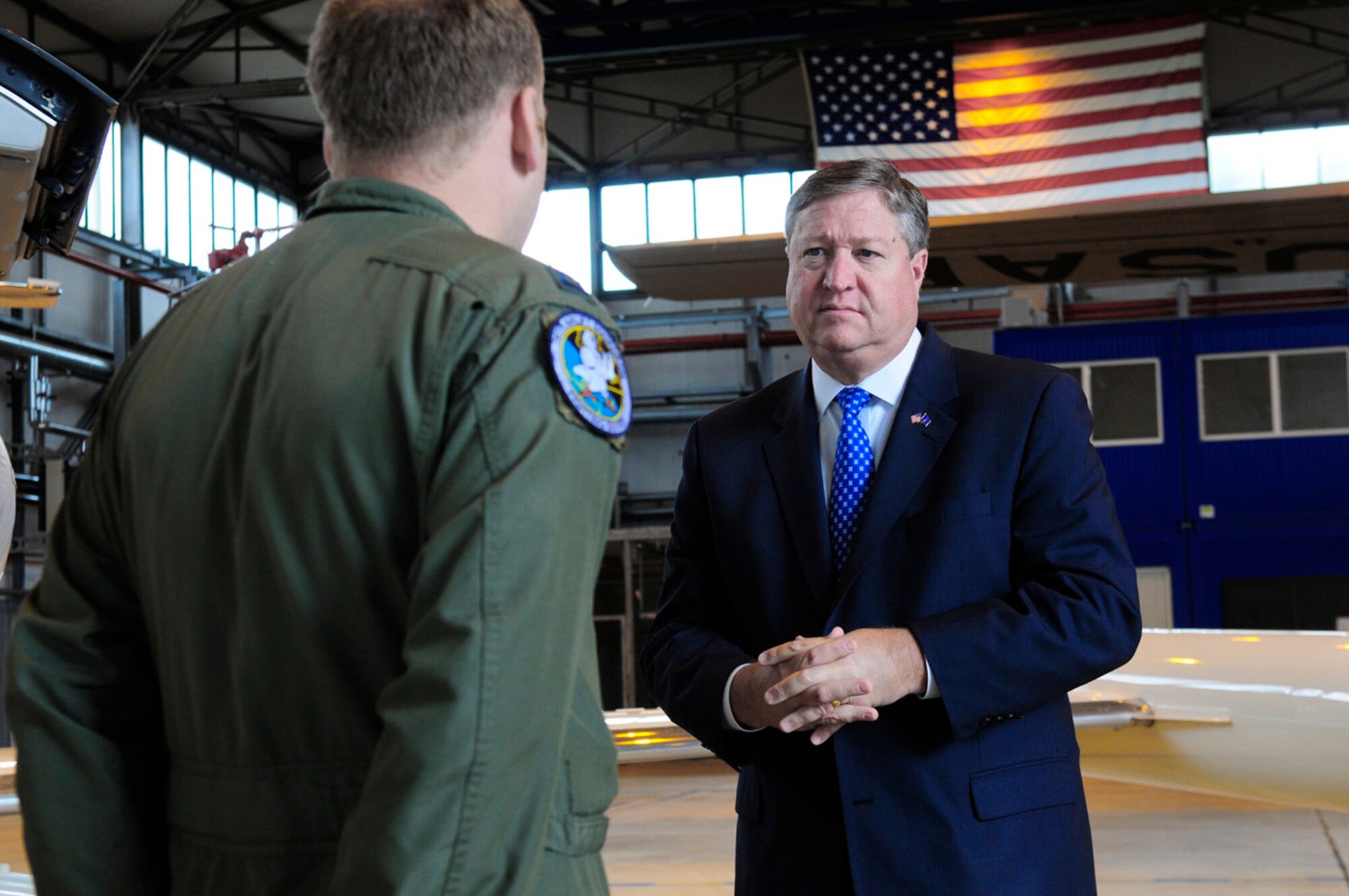 Capt. Daniel Helland briefs Secretary of the Air Force Michael Donley June 18, 2011, on C-21A aircraft aeromedical evacuation operations at Ramstein Air Base, Germany. The secretary traveled to Europe to meet with Airmen and receive updates from command leaders on U.S. Air Forces in Europe efforts to build partnership capacity and ongoing contingency support for Operation Unified Protector. Captain Helland is assigned to the 76th Airlift Squadron. (U.S. Air Force photo/Airman 1st Class Brea Miller)