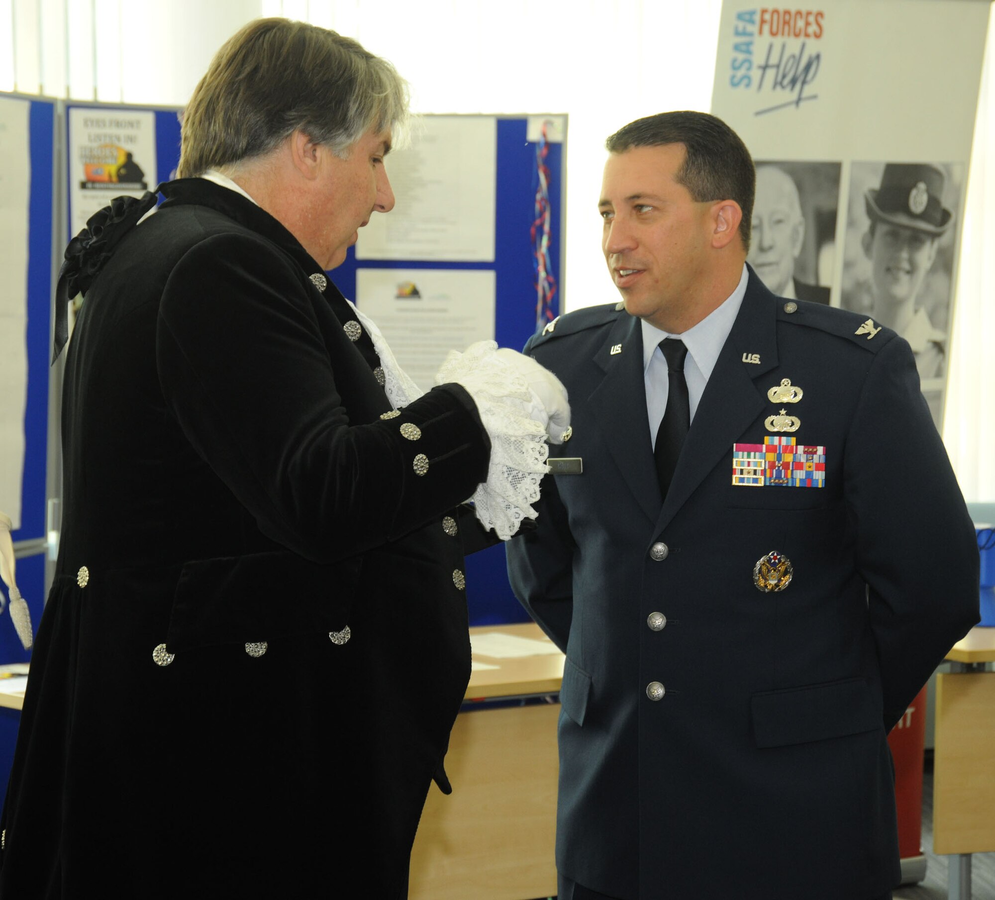 Colonel Brian Kelly speaks with the High Sherriff of Cambridgeshire Richard Barnwell during a U.K. Armed Forces Day event at the Huntingdon District Council June 20.