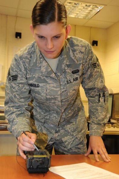 Senior Airman Jessica Lubold, 423rd Communications Squadron, checks COMSEC material in accordance with the approved checklist. She is the 423rd Air Base Group 501st Everyday Hero award winner.
. 
