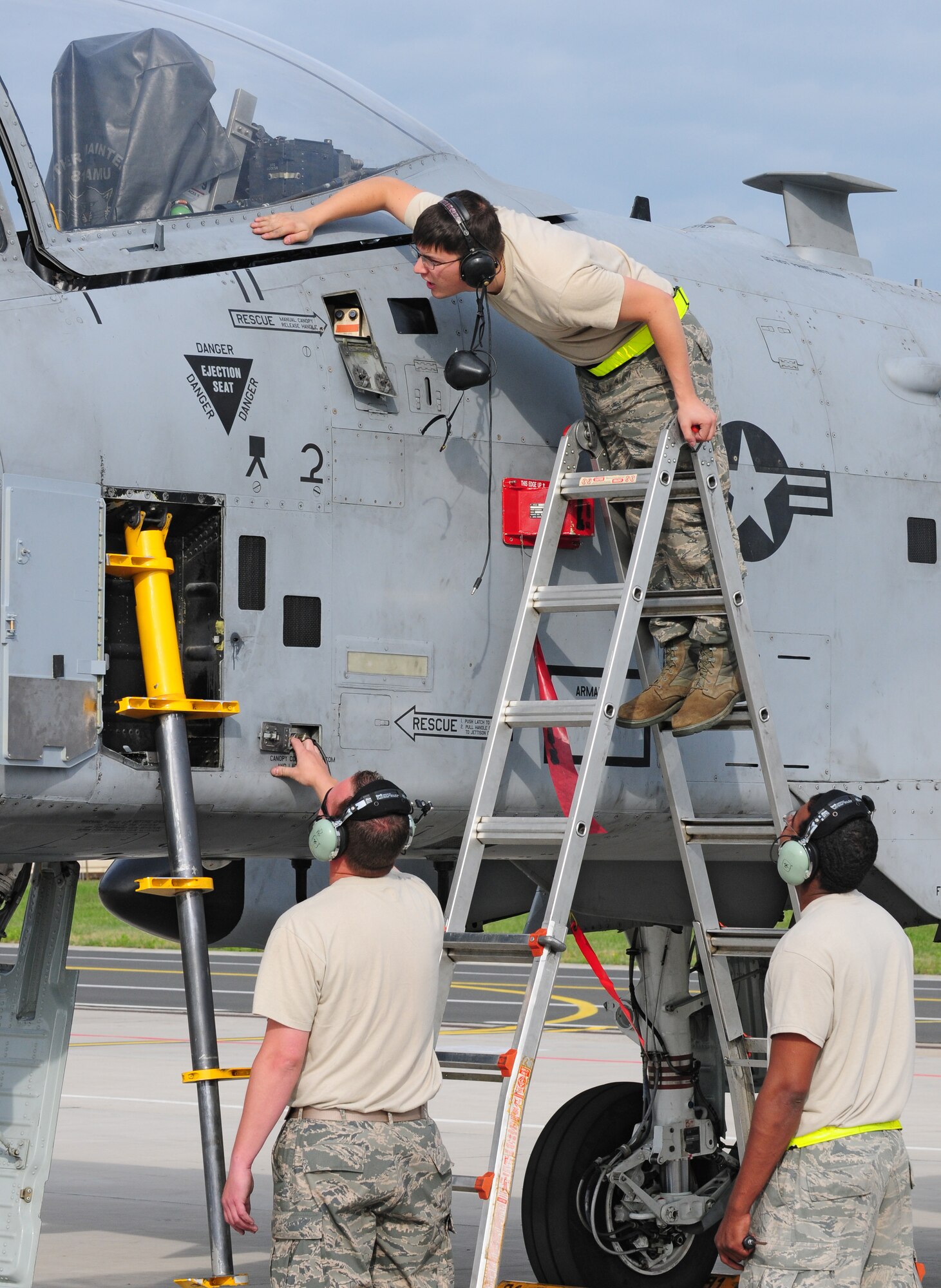 SPANGDAHLEM AIR BASE, Germany – 52nd Aircraft Maintenance Squadron Aircraft Electrical and Environmental Systems Maintainers Staff Sgt. Wesley Britt, left, Senior Airmen William Jones and Justin Vesely, above, work together to locate and fix a problem with the canopy of an A-10 Thunderbolt II here June 16. The 81st Aircraft Maintenance Unit within the 52nd AMXS works to maintain, service, inspect, launch and recover the A-10 Thunderbolt IIs flown by the 81st Fighter Squadron. (U.S. Air Force photo/Airman 1st Class Matthew B. Fredericks)