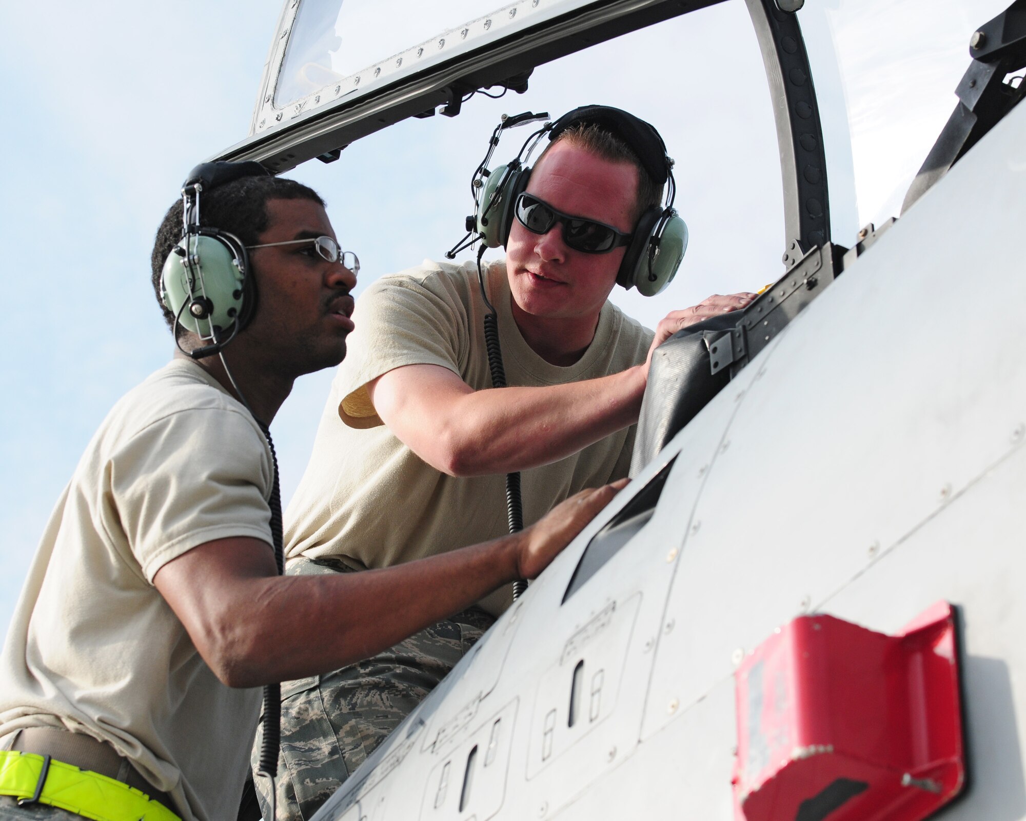 SPANGDAHLEM AIR BASE, Germany – Senior Airman William Jones, 52nd Aircraft Maintenance Squadron aircraft electrical and environmental systems journeyman, and Staff Sgt. Wesley Britt, 52nd AMXS aircraft electrical and environmental systems craftsman, inspect an A-10 Thunderbolt II cockpit to locate and fix a problem with the canopy here June 16. The 81st Aircraft Maintenance Unit within the 52nd AMXS works to maintain, service, inspect, launch and recover the A-10 Thunderbolt IIs flown by the 81st Fighter Squadron. (U.S. Air Force photo/Airman 1st Class Matthew B. Fredericks)