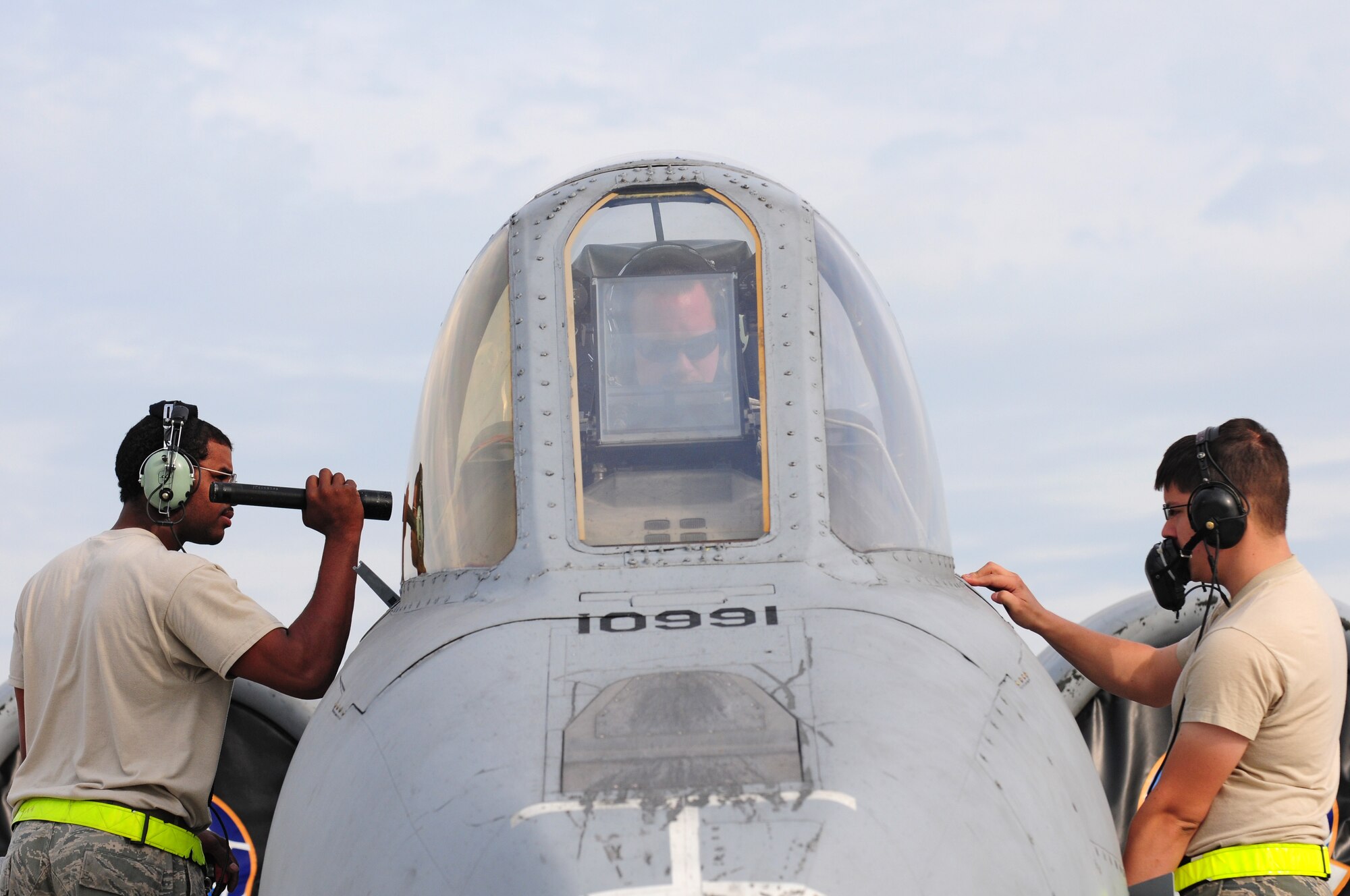 SPANGDAHLEM AIR BASE, Germany – Senior Airmen William Jones, left, and Justin Vesely, right, 52nd Aircraft Maintenance Squadron aircraft electrical and environmental systems journeymen, work with Staff Sgt. Wesley Britt, 52nd AMXS aircraft and environmental systems craftsman, to locate and fix a problem with the canopy of an A-10 Thunderbolt II here June 16. The 81st Aircraft Maintenance Unit within the 52nd AMXS works to maintain, service, inspect, launch and recover the A-10 Thunderbolt IIs flown by the 81st Fighter Squadron. (U.S. Air Force photo/Airman 1st Class Matthew B. Fredericks)