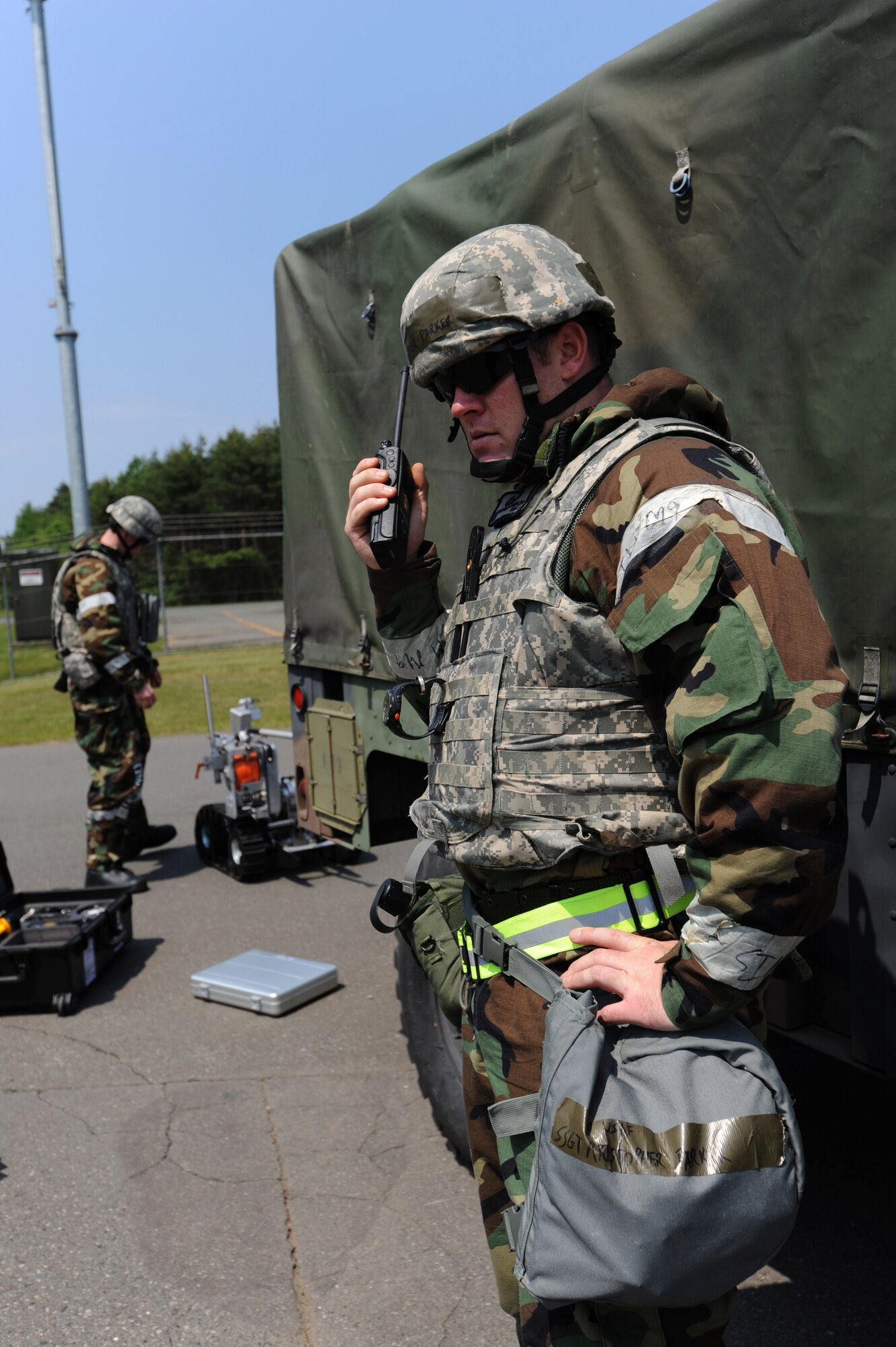 MISAWA AIR BASE, Japan -- Staff Sgt. Kristopher Parker, 35th Civil Engineer Squadron explosive ordnance disposal technician, relays information about an improvised explosive device during a training exercise June 20. During the training exercise, Airmen practice operating in a combat environment.  (U.S. Air Force photo/Staff Sgt. April Quintanilla)