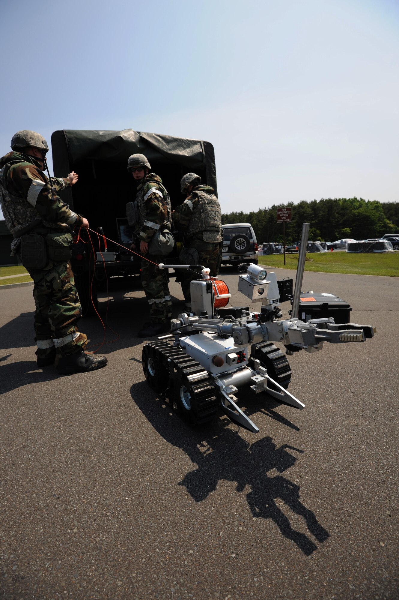 MISAWA AIR BASE, Japan -- Members of the 35th Civil Engineer Squadron explosive ordnance disposal team respond to a report of a suspicious package during a training exercise June 20.  The 35th Fighter Wing is engaged in a week-long exercise, simulating a variety of scenarios in a combat environment. (U.S. Air Force photo/Staff Sgt. April Quintanilla)