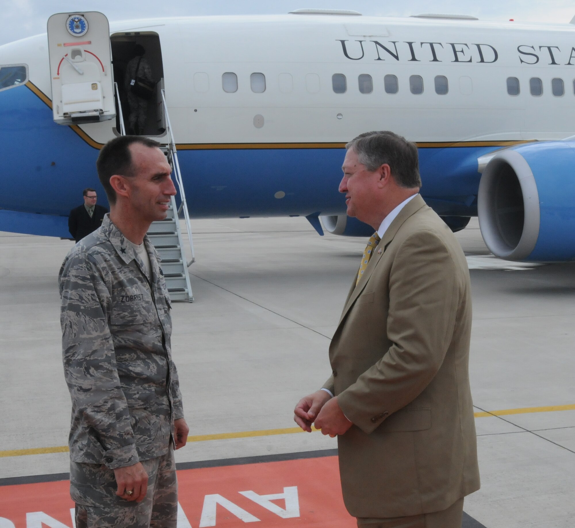 31st Fighter Wing Commander Brig. Gen. Scott J. Zobrist (right) and Secretary of the Air Force Michael Donley exchange parting salutations prior to the secretary’s departure from Aviano Air Base, Italy, June 17, 2011. (U.S. Air Force photo/Airman LaVel Sterling)