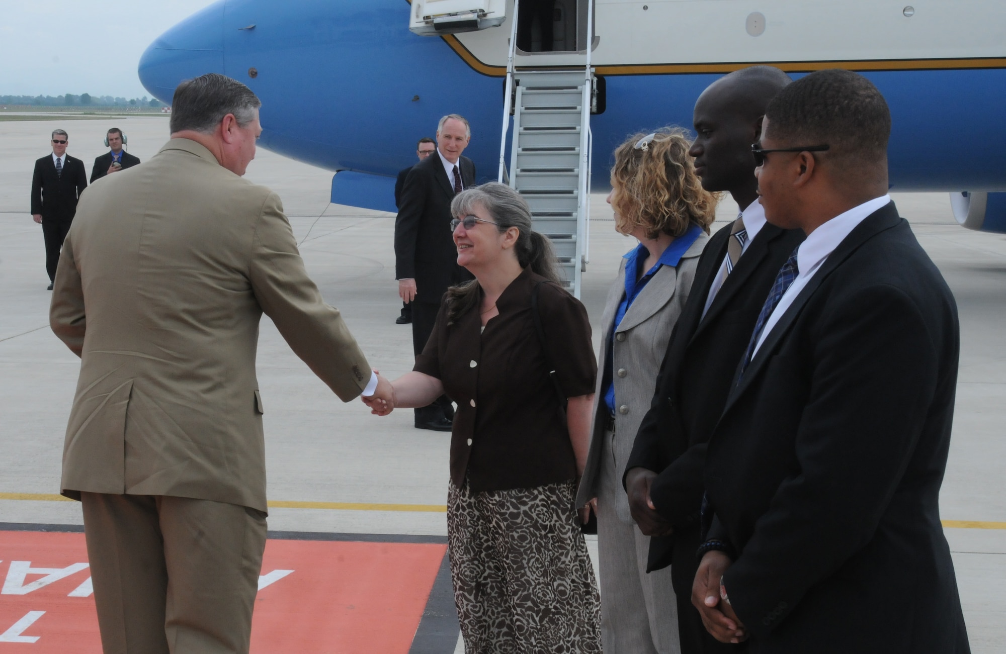 Secretary of the Air Force Michael Donley shakes hands with Mary Mitchell, 31st Fighter Wing protocol specialist, before departing Aviano Air Base, Italy, June 17, 2011. (U.S. Air Force photo/Airman LaVel Sterling)