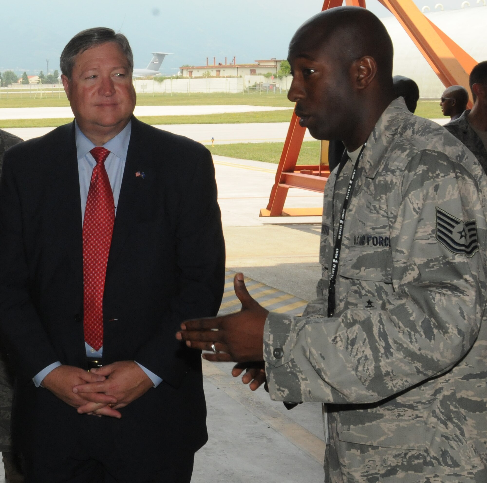 Tech. Sgt. Timothy Whitfield, 31st Munitions Squadron munitions support equipment section chief, briefs Secretary of the Air Force Michael Donley on certified equipment vehicles during the secretary’s visit to Aviano Air Base, Italy, June 16, 2011. (U.S. Air Force photo/Airman LaVel Sterling)