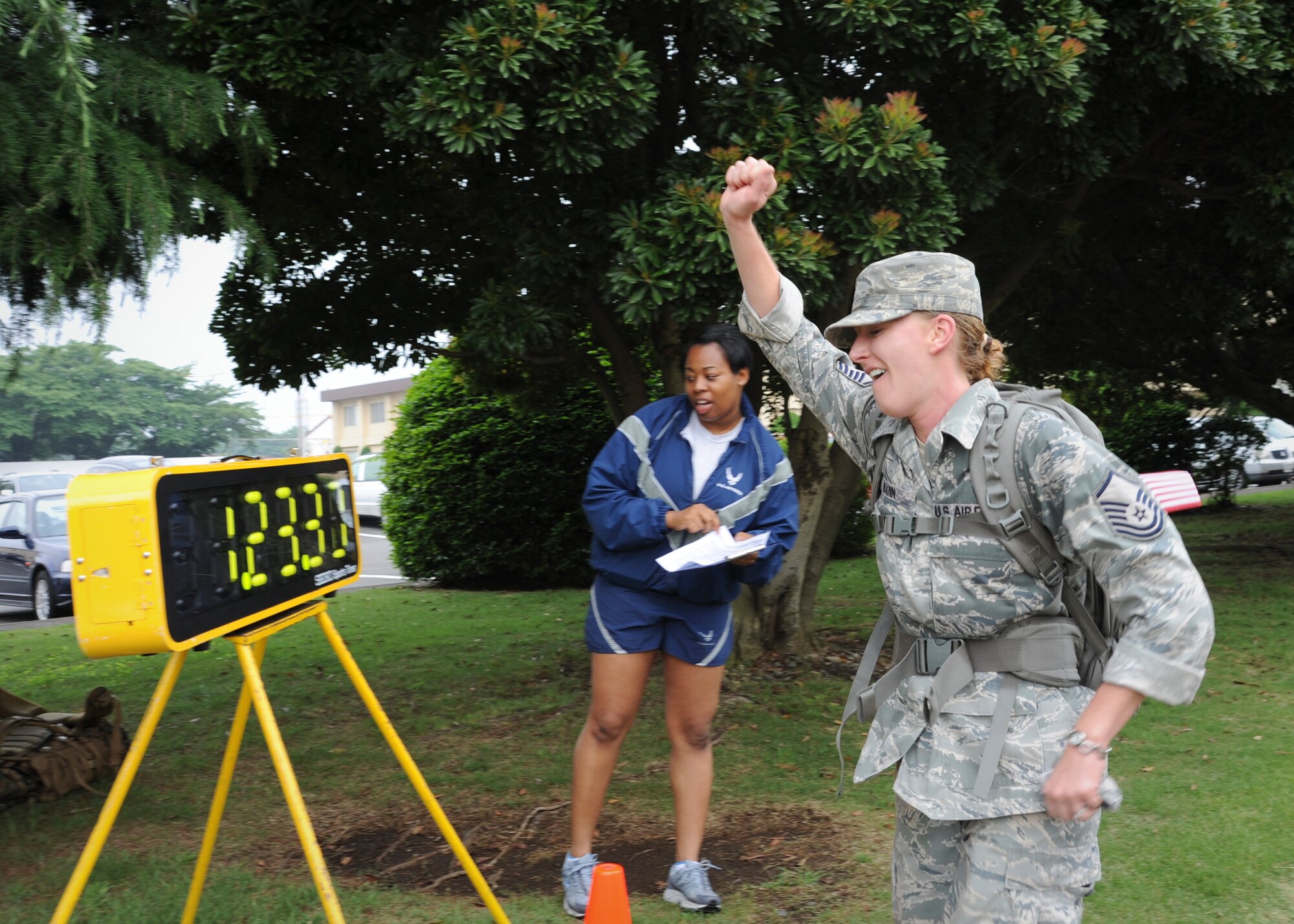 YOKOTA AIR BASE, Japan -- Master Sgt. Christina Mann, Department of Defense Special Representative member, finishes a ruck march honoring the U.S. Army's 236th birthday Yokota Air Base, Japan., June, 14, 2011. Sergeant Mann was the first female to complete the seven-mile march. (U.S. Air Force photo/Senior Airman Andrea Salazar)