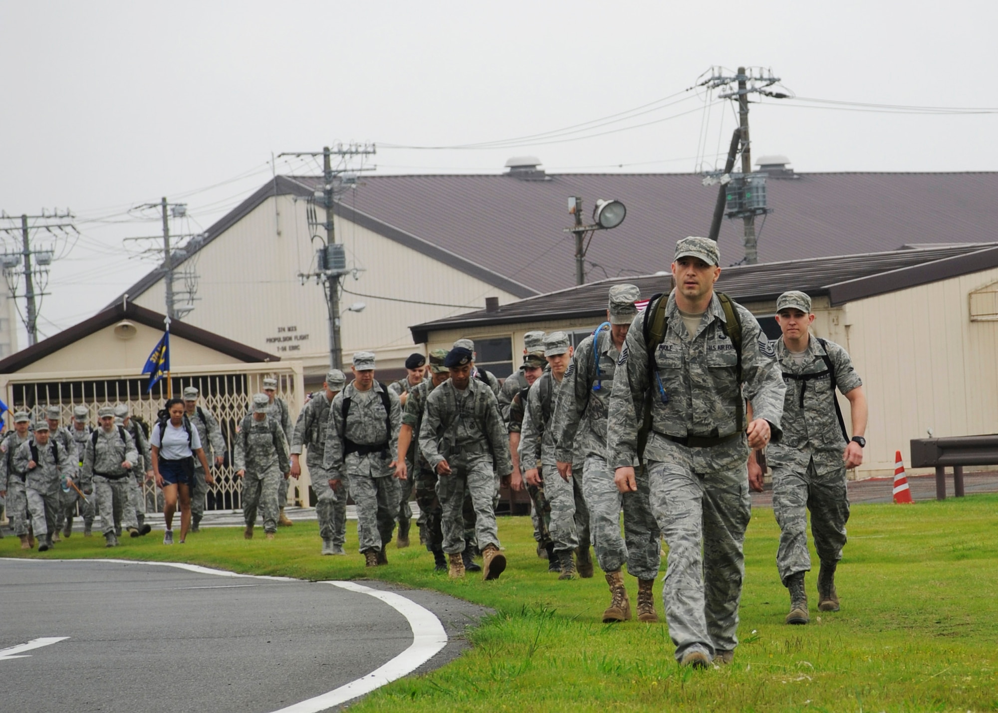 YOKOTA AIR BASE, Japan -- Yokota members march around the base during a ruck march at Yokota Air Base, Japan, June 14, 2011. The ruck march was held in observance of the U.S. Army's 236th birthday. Approximately 100 active-duty servicemembers and family participated in the ruck march. (U.S. Air Force photo/Senior Airman Andrea Salazar)